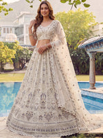 Charming Cream Embroidered Net Engagement Wear Lehenga Choli