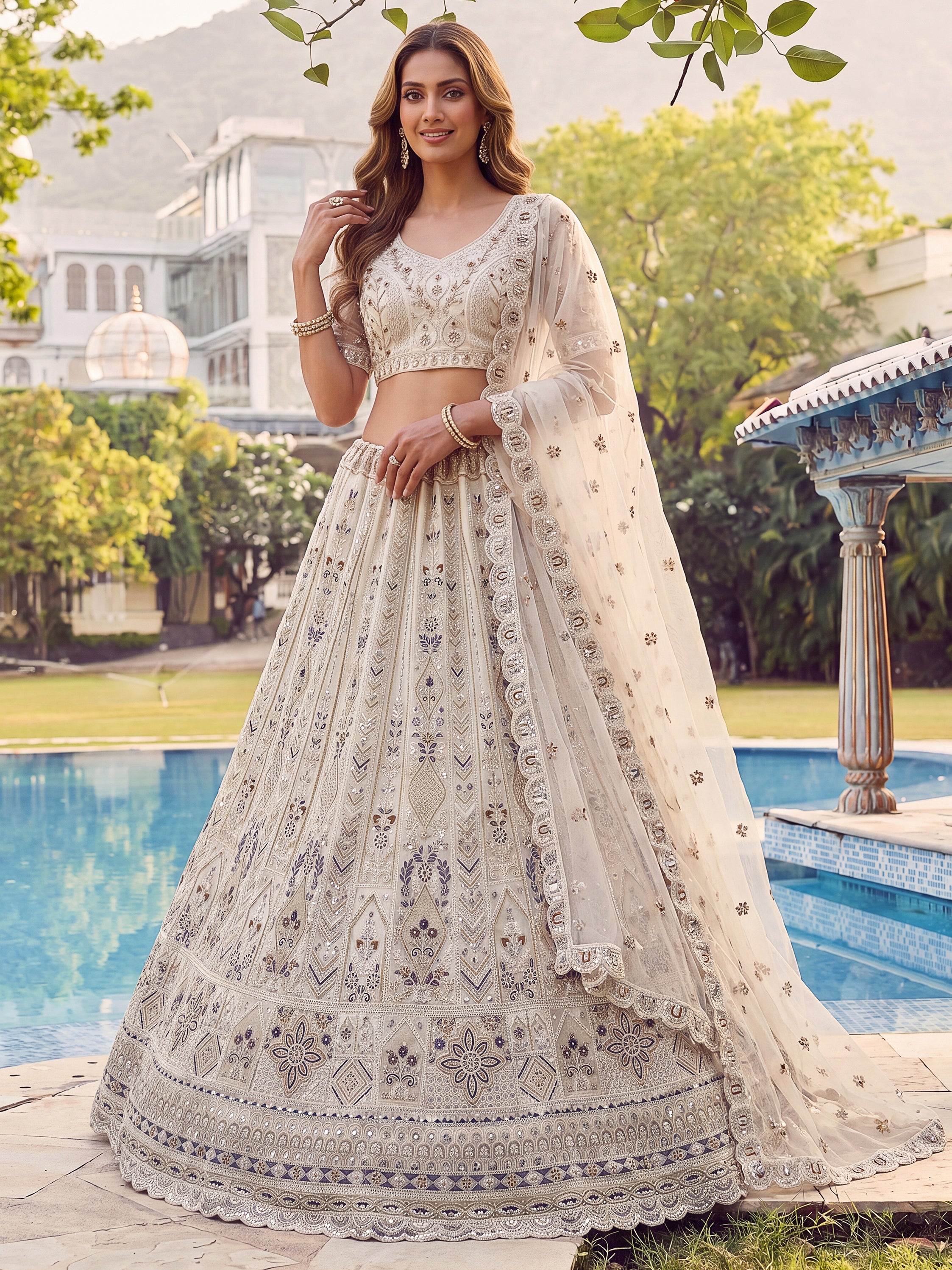 Charming Cream Zari Embroidered Net Reception Wear Lehenga Choli