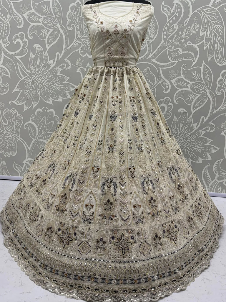 Charming Cream Embroidered Net Engagement Wear Lehenga Choli