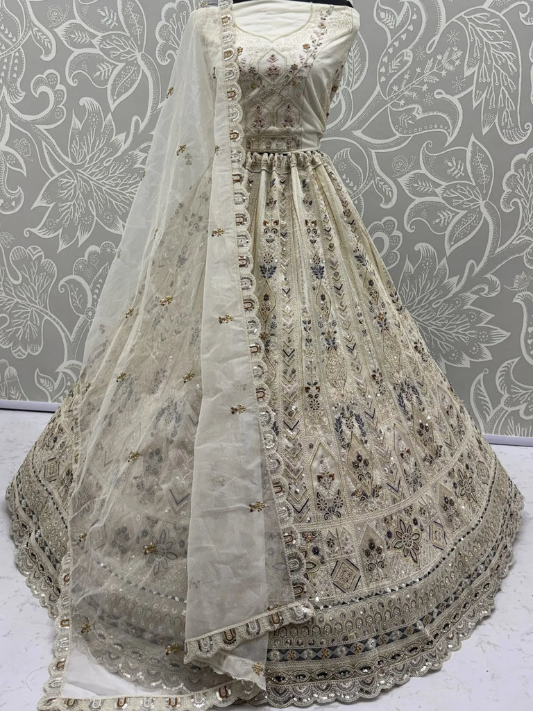 Charming Cream Embroidered Net Engagement Wear Lehenga Choli