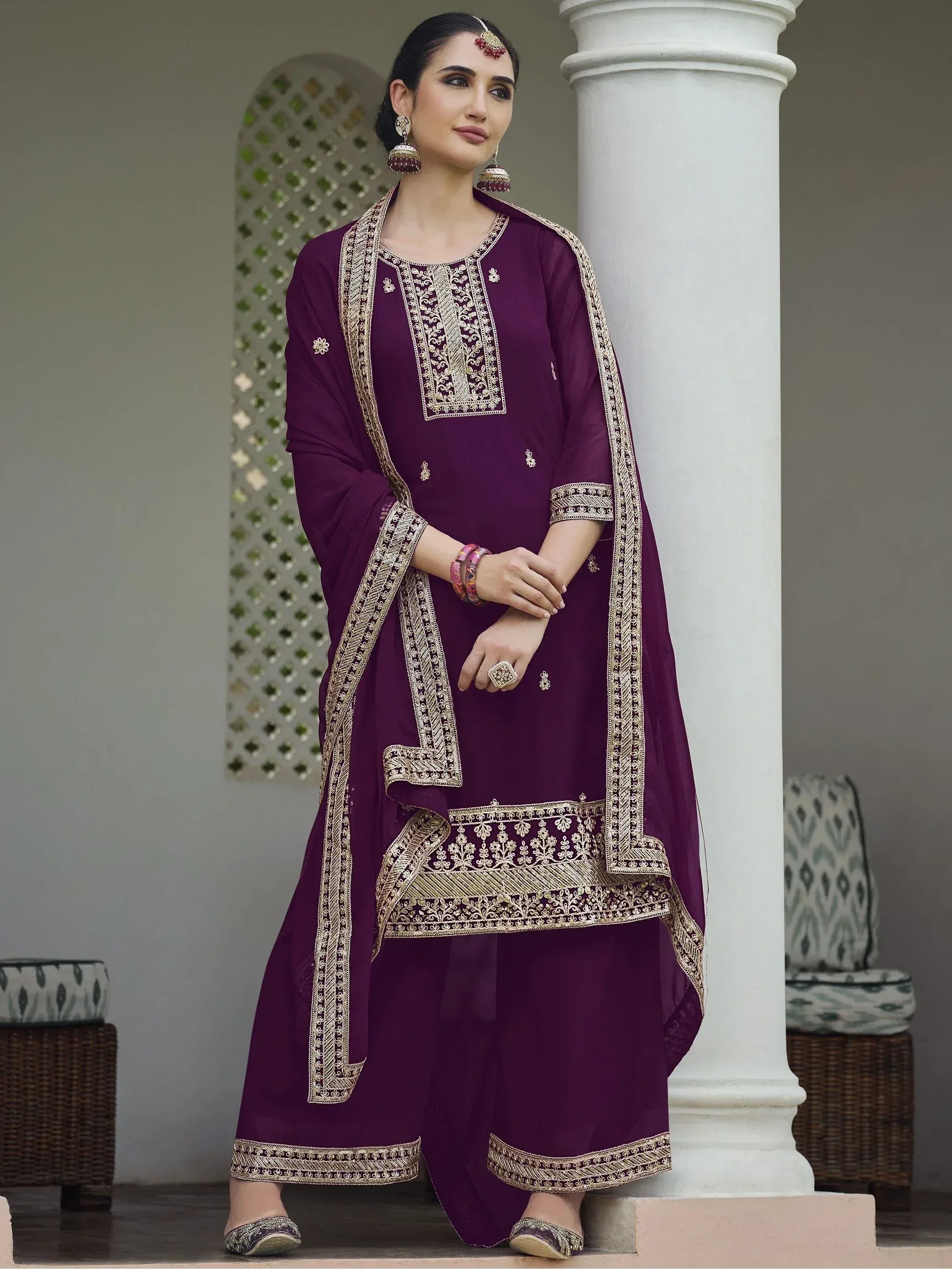Woman in a purple embroidered salwar kameez with dupatta, traditional Indian ethnic wear