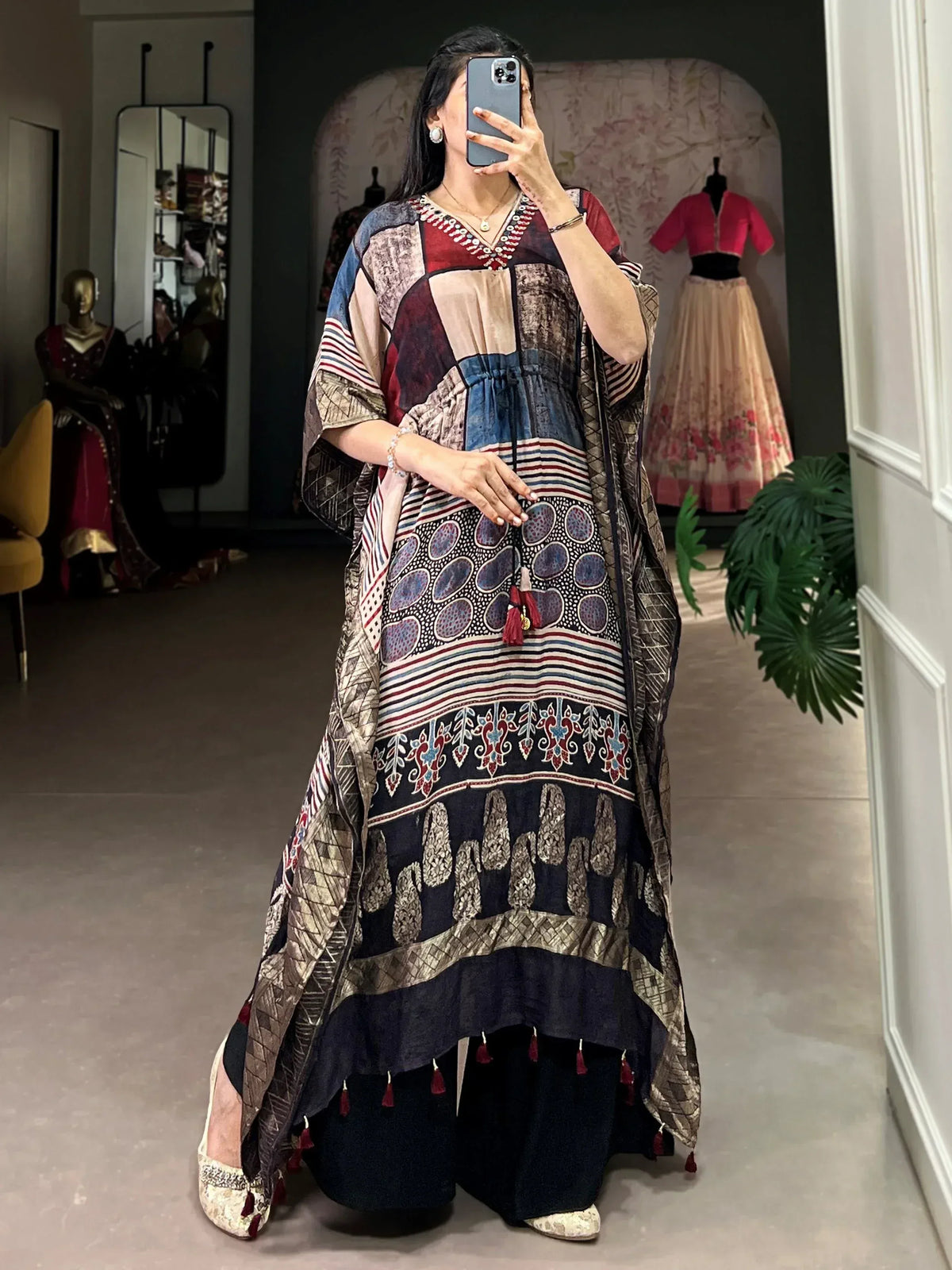 Ethnic printed kaftan gown with tassels, paired with palazzo pants for festive occasions