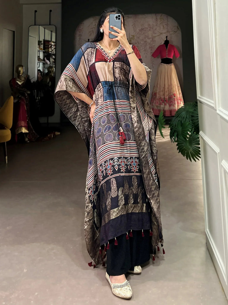 Ethnic printed kaftan with tassels, paired with palazzo pants and embellished flats for festive occasions.