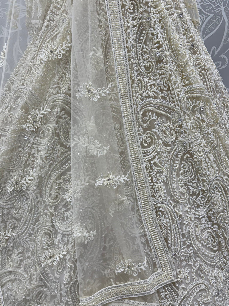 Monochrome White Hand Embroidered Net Wedding Wear Lehenga Choli