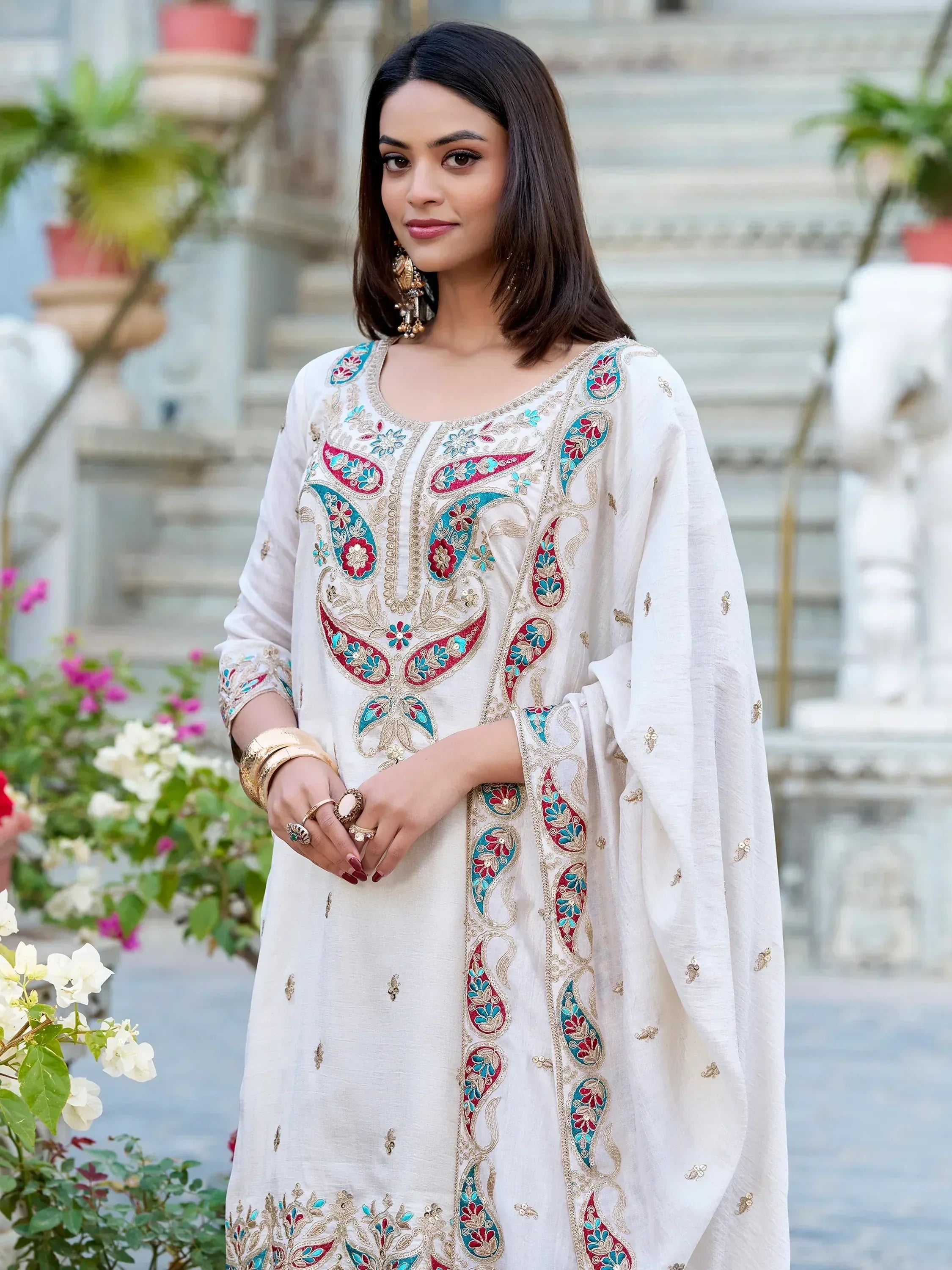 White embroidered kurta with red and blue paisley design, ethnic wear for women