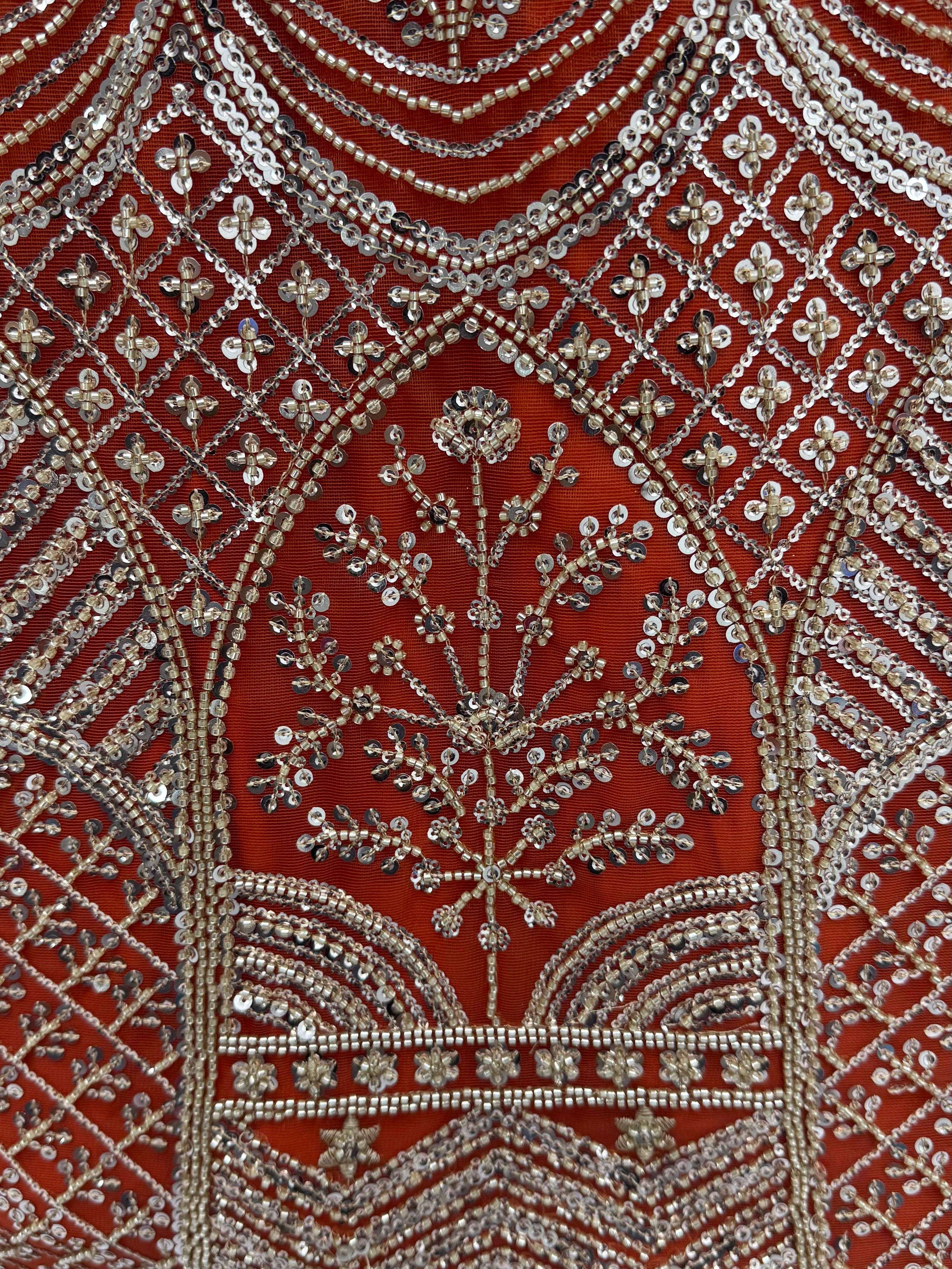 Wonderful Rust Orange Sequins Net Wedding Wear Lehenga Choli