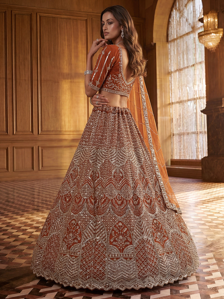 Wonderful Rust Orange Sequins Net Wedding Wear Lehenga Choli