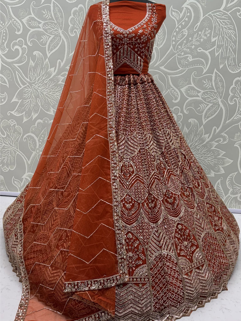 Wonderful Rust Orange Sequins Net Wedding Wear Lehenga Choli