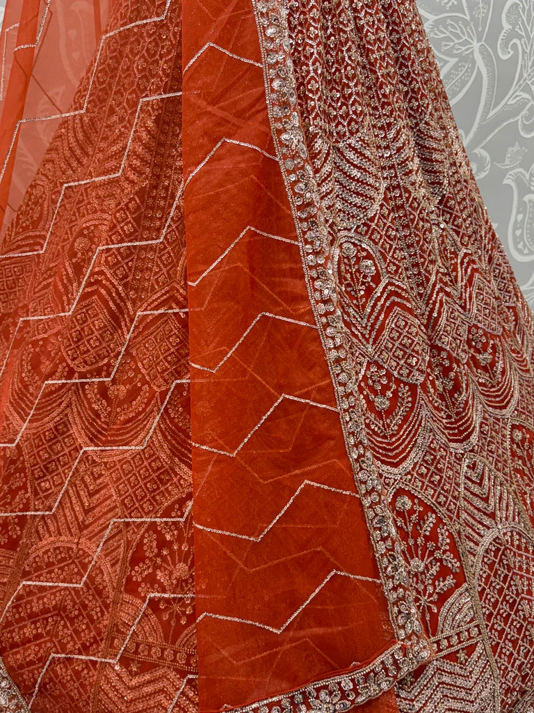 Wonderful Rust Orange Sequins Net Wedding Wear Lehenga Choli