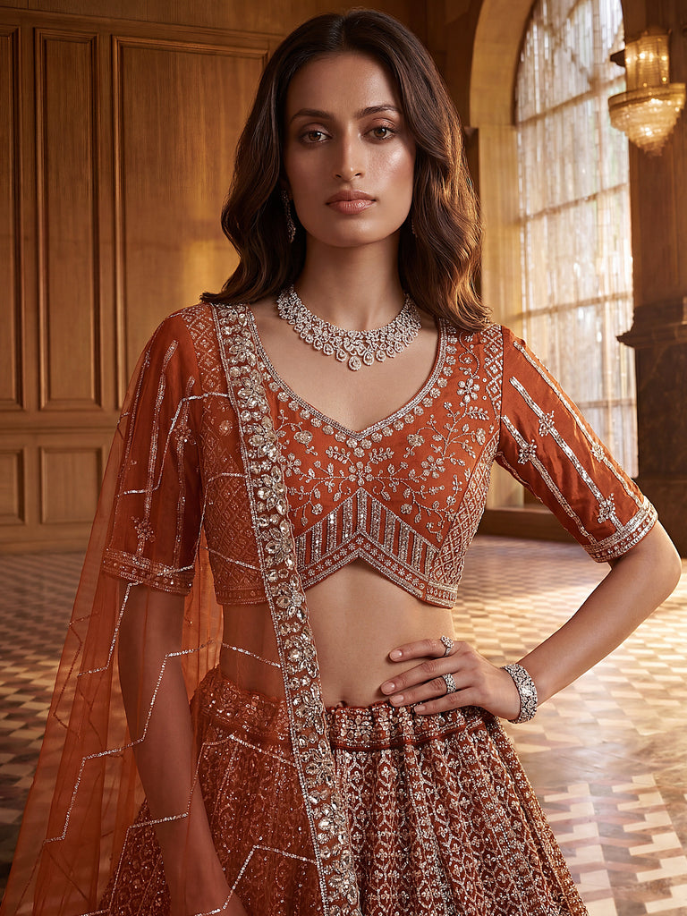Wonderful Rust Orange Sequins Net Wedding Wear Lehenga Choli