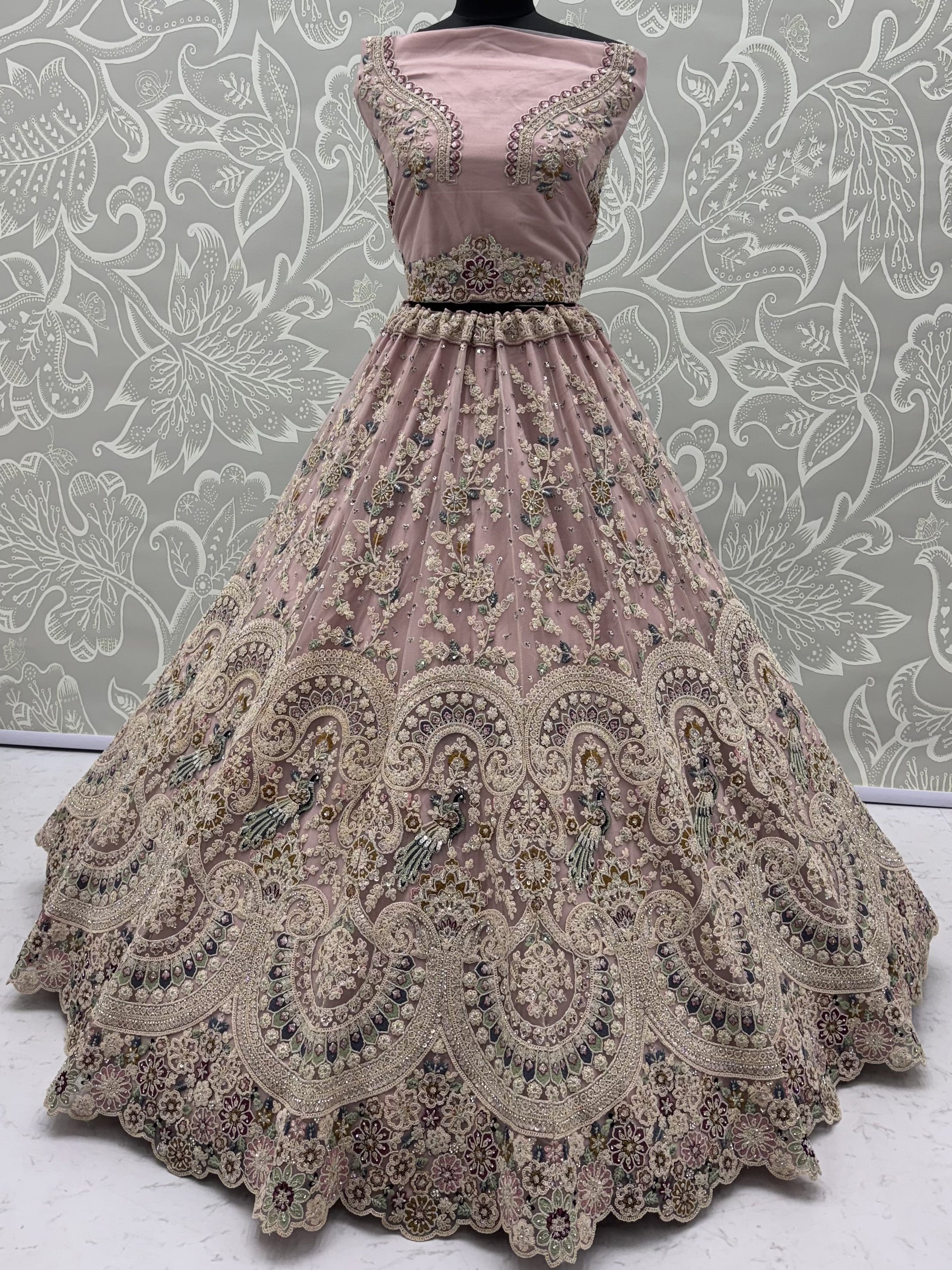 Lavish Dusty Pink Thread Embroidered Net Engagement Wear Lehenga Choli