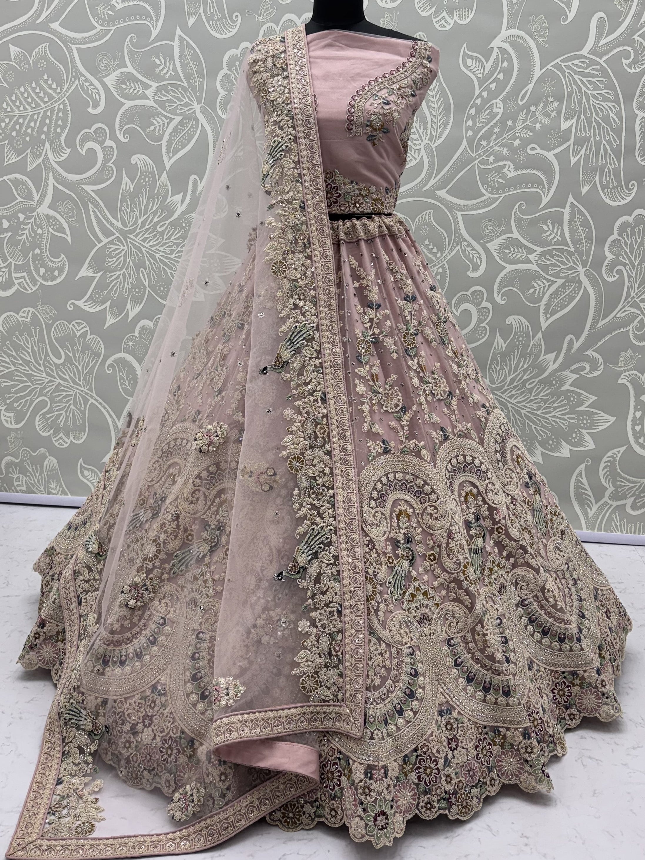 Lavish Dusty Pink Thread Embroidered Net Engagement Wear Lehenga Choli