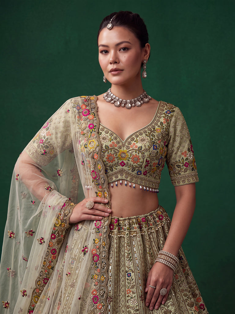 Luxurious Pista Green Hand Embroidered Silk Reception Wear Lehenga Choli