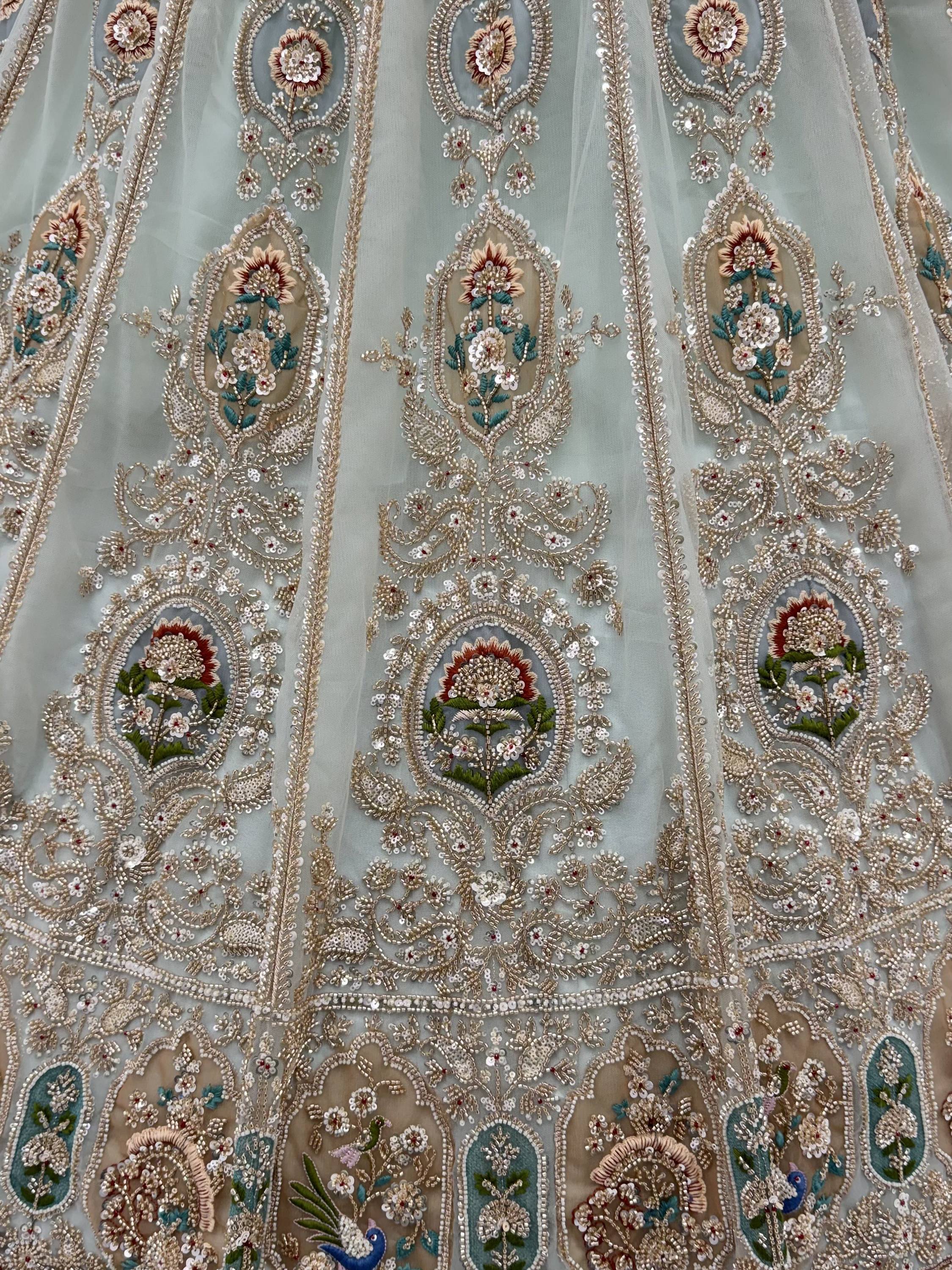 Rich Mint Green Heavy Embroidered Net Reception Wear Lehenga Choli