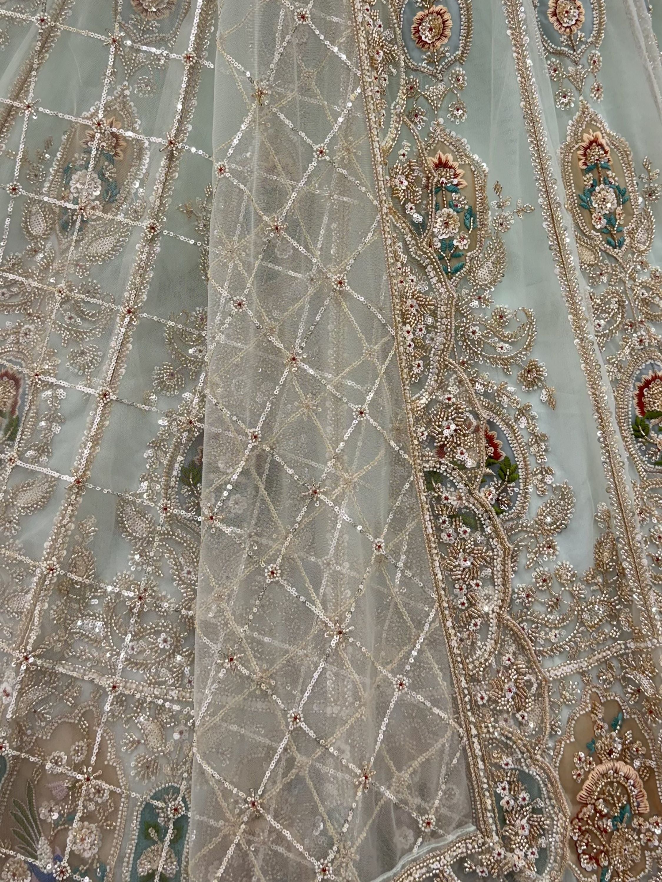 Rich Mint Green Heavy Embroidered Net Reception Wear Lehenga Choli