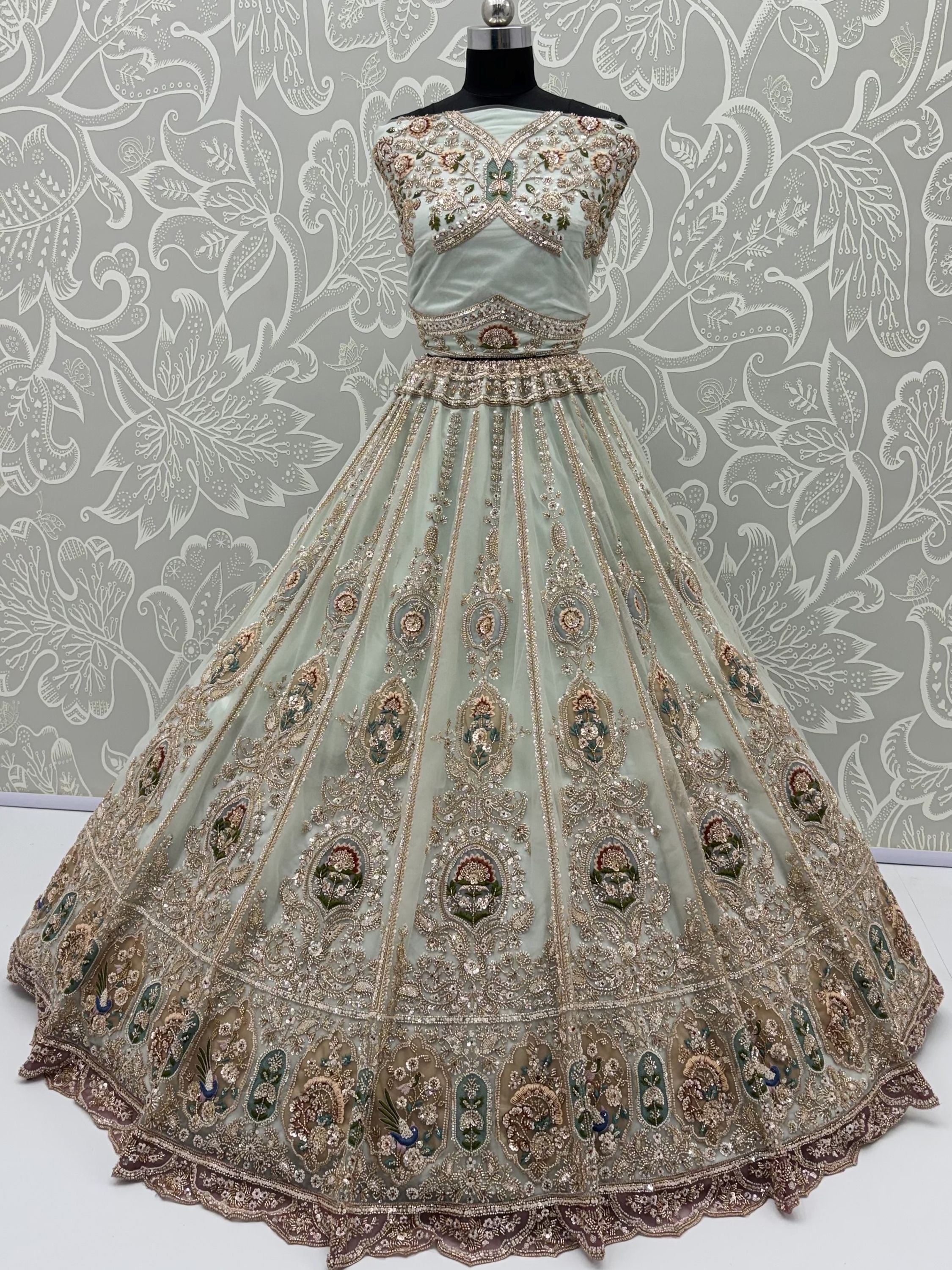 Rich Mint Green Heavy Embroidered Net Reception Wear Lehenga Choli
