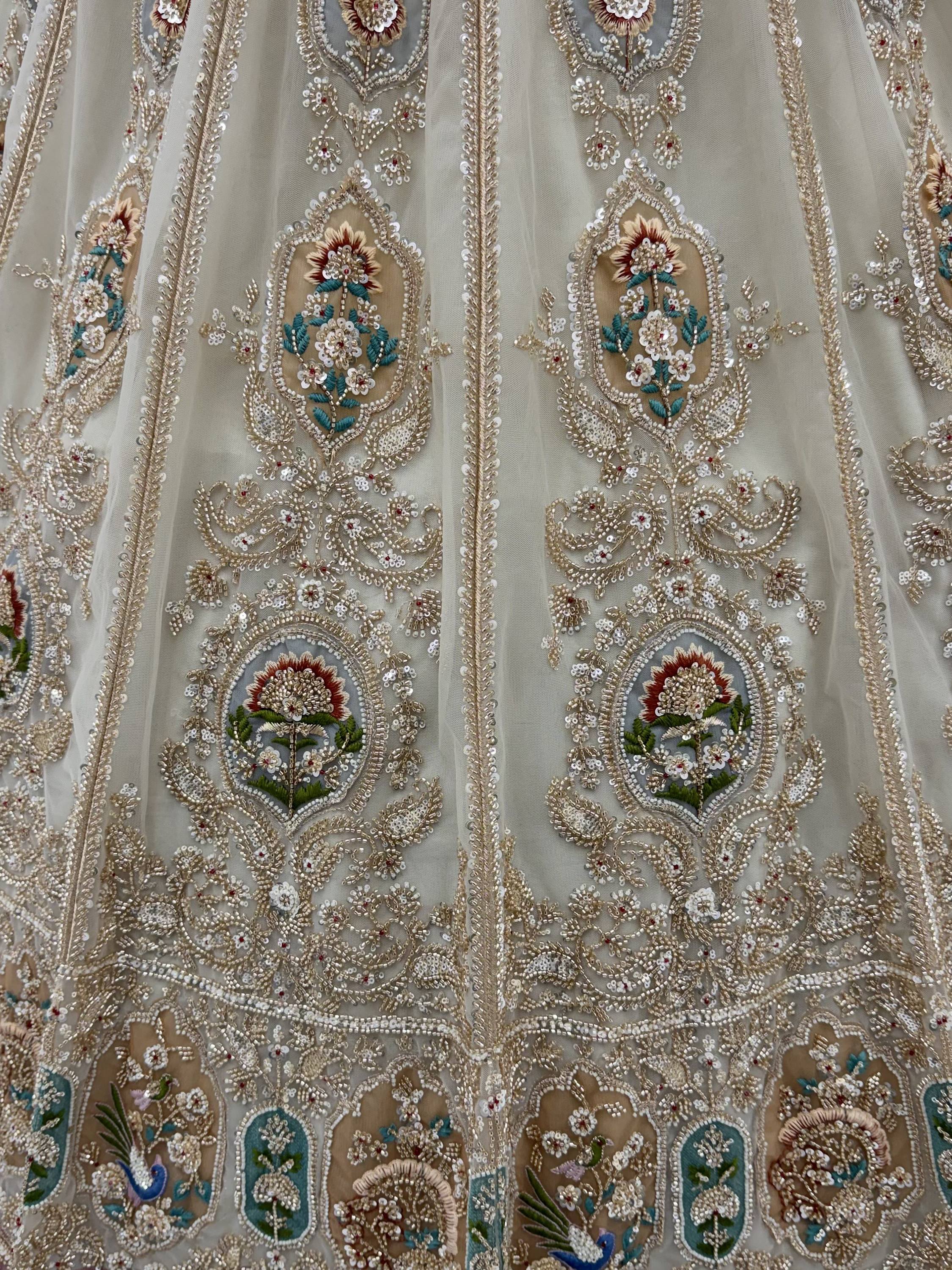 Noteworthy Beige Zari Work Net Sangeet Wear Lehenga Choli With Dupatta