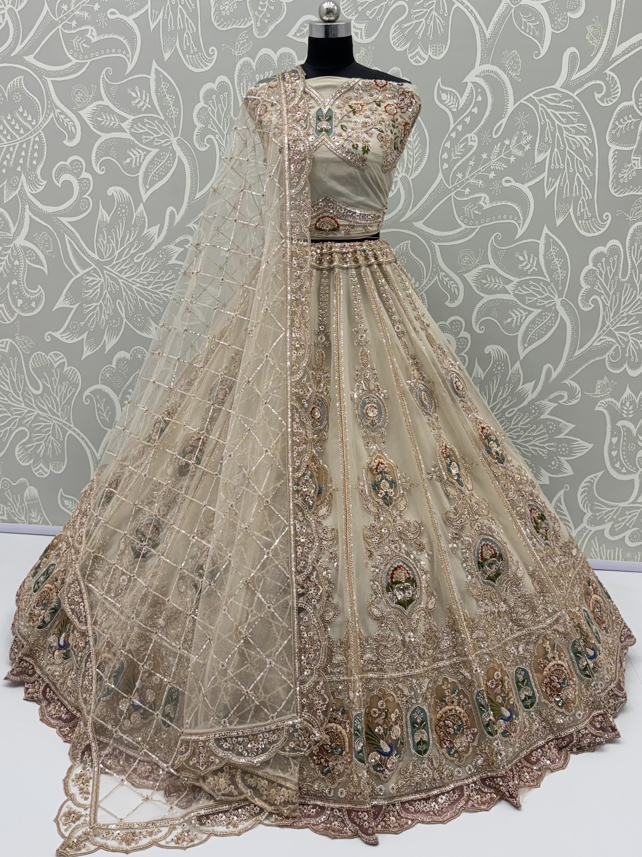 Noteworthy Beige Zari Work Net Sangeet Wear Lehenga Choli With Dupatta