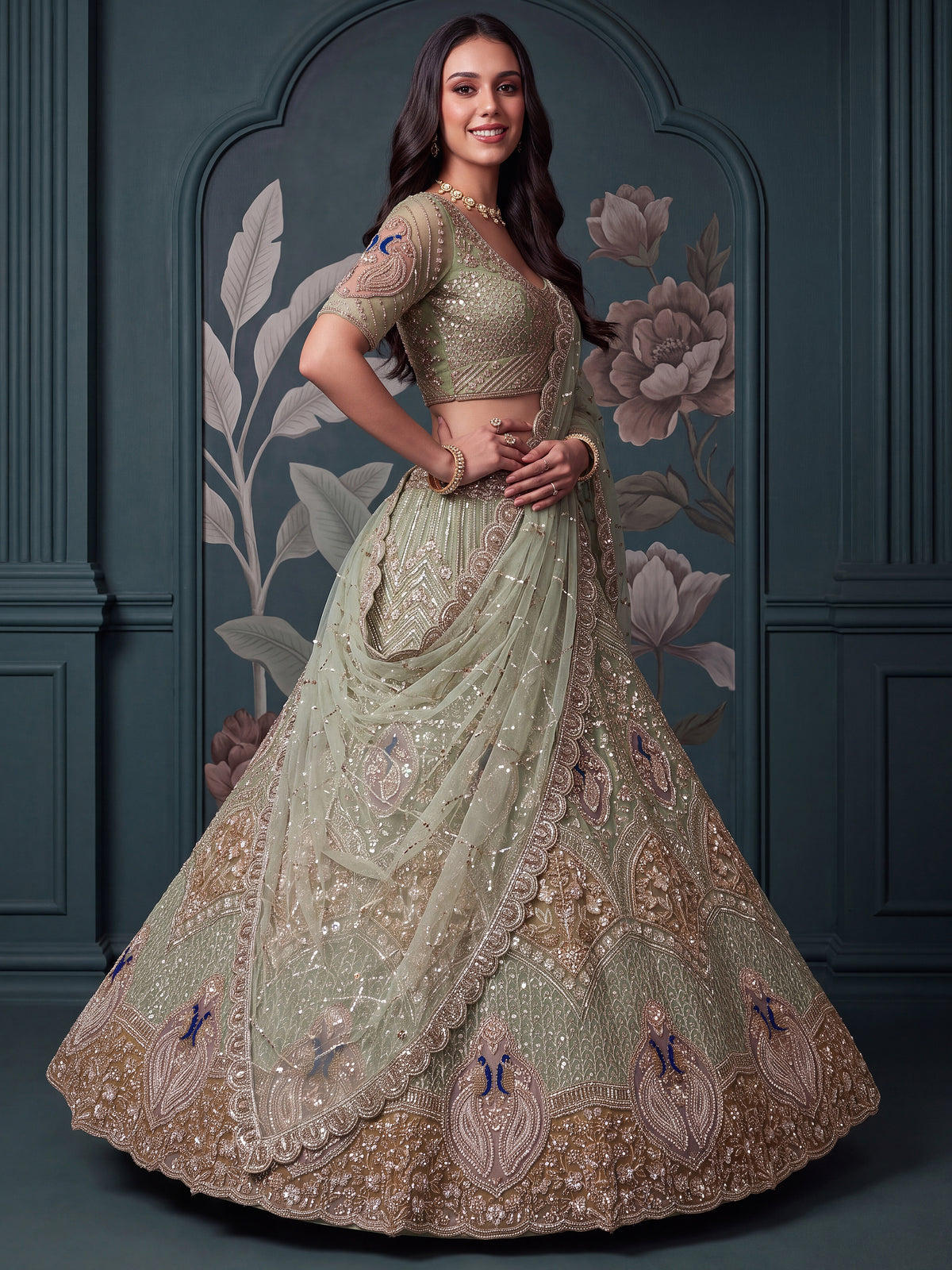 Luxurious Pista Green Hand Work Net Reception Wear Lehenga Choli With Dupatta