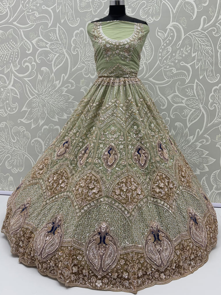Luxurious Pista Green Hand Work Net Reception Wear Lehenga Choli With Dupatta