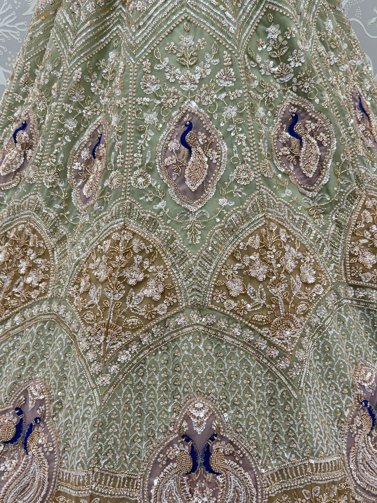 Luxurious Pista Green Hand Work Net Reception Wear Lehenga Choli With Dupatta