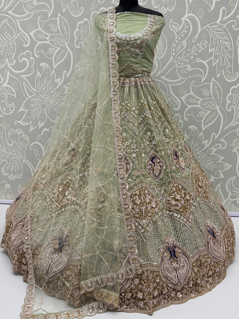 Luxurious Pista Green Hand Work Net Reception Wear Lehenga Choli With Dupatta