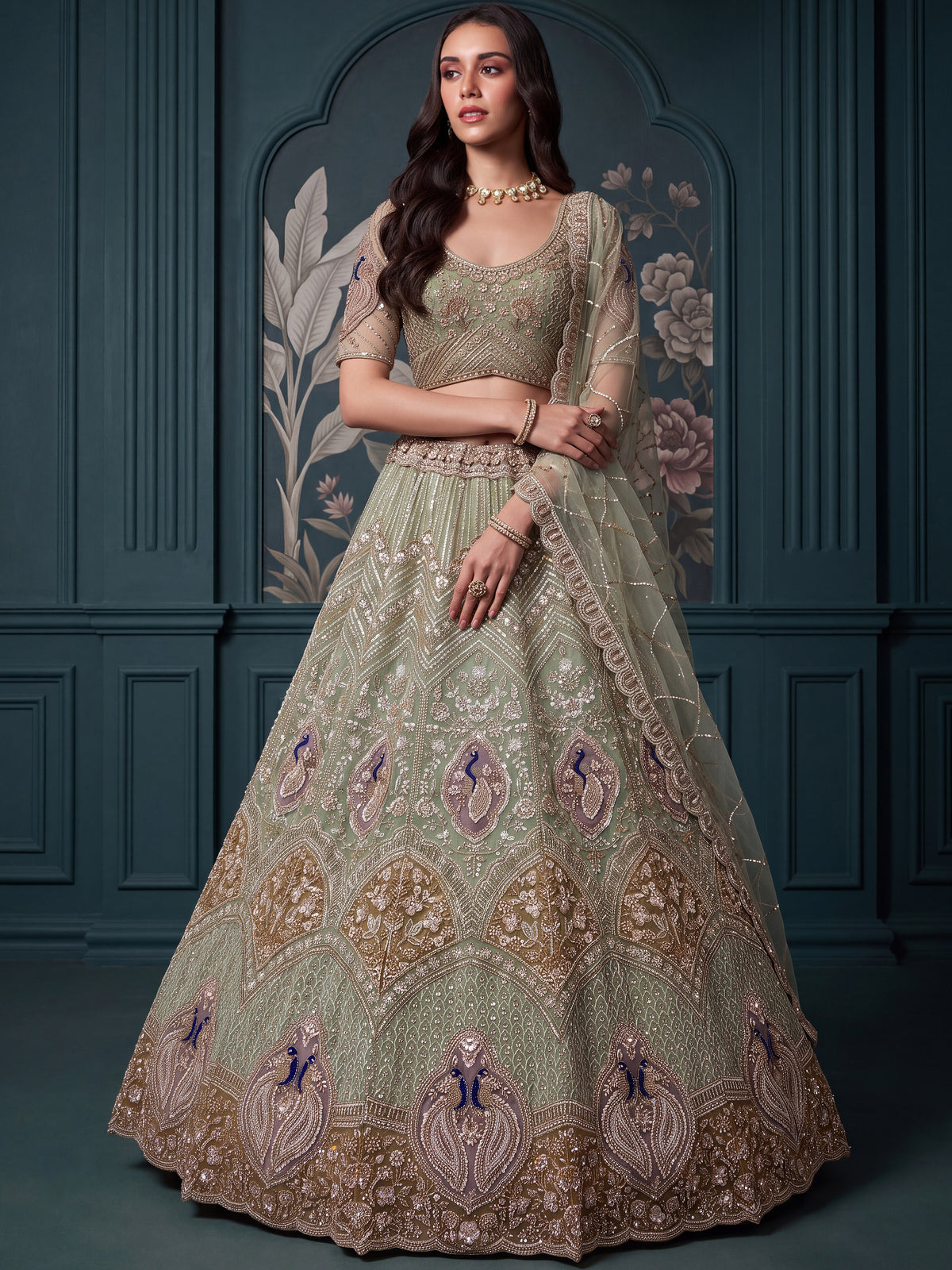 Luxurious Pista Green Hand Work Net Reception Wear Lehenga Choli With Dupatta
