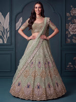 Luxurious Pista Green Hand Work Net Reception Wear Lehenga Choli With Dupatta