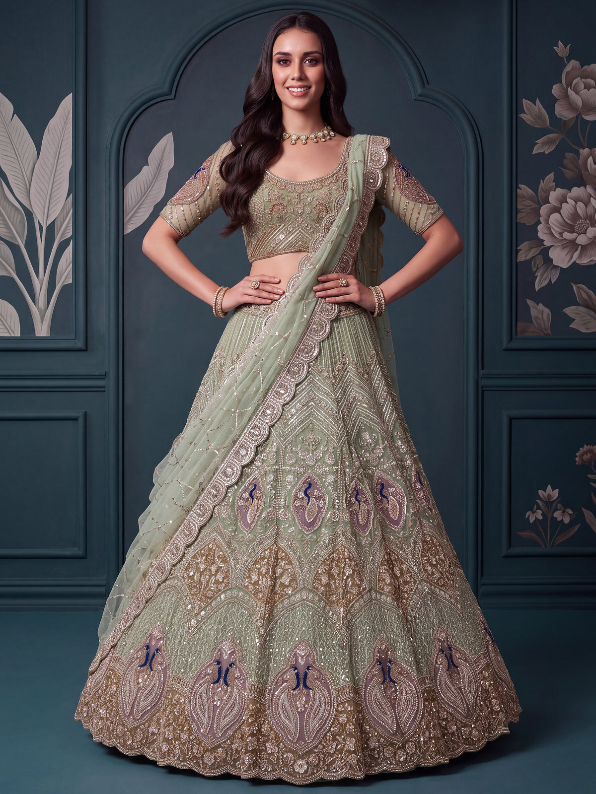 Luxurious Pista Green Hand Work Net Reception Wear Lehenga Choli With Dupatta