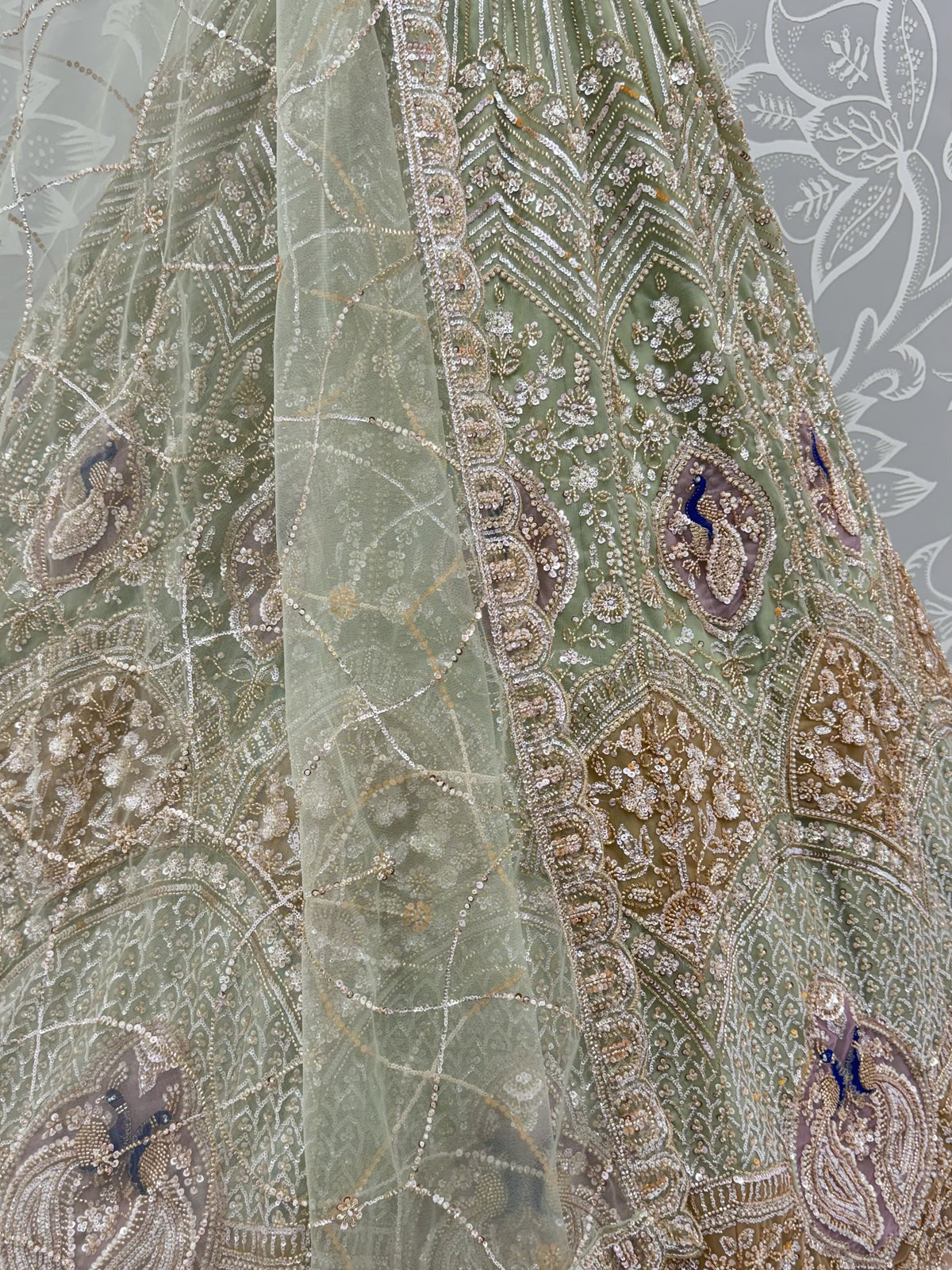 Luxurious Pista Green Hand Work Net Reception Wear Lehenga Choli With Dupatta