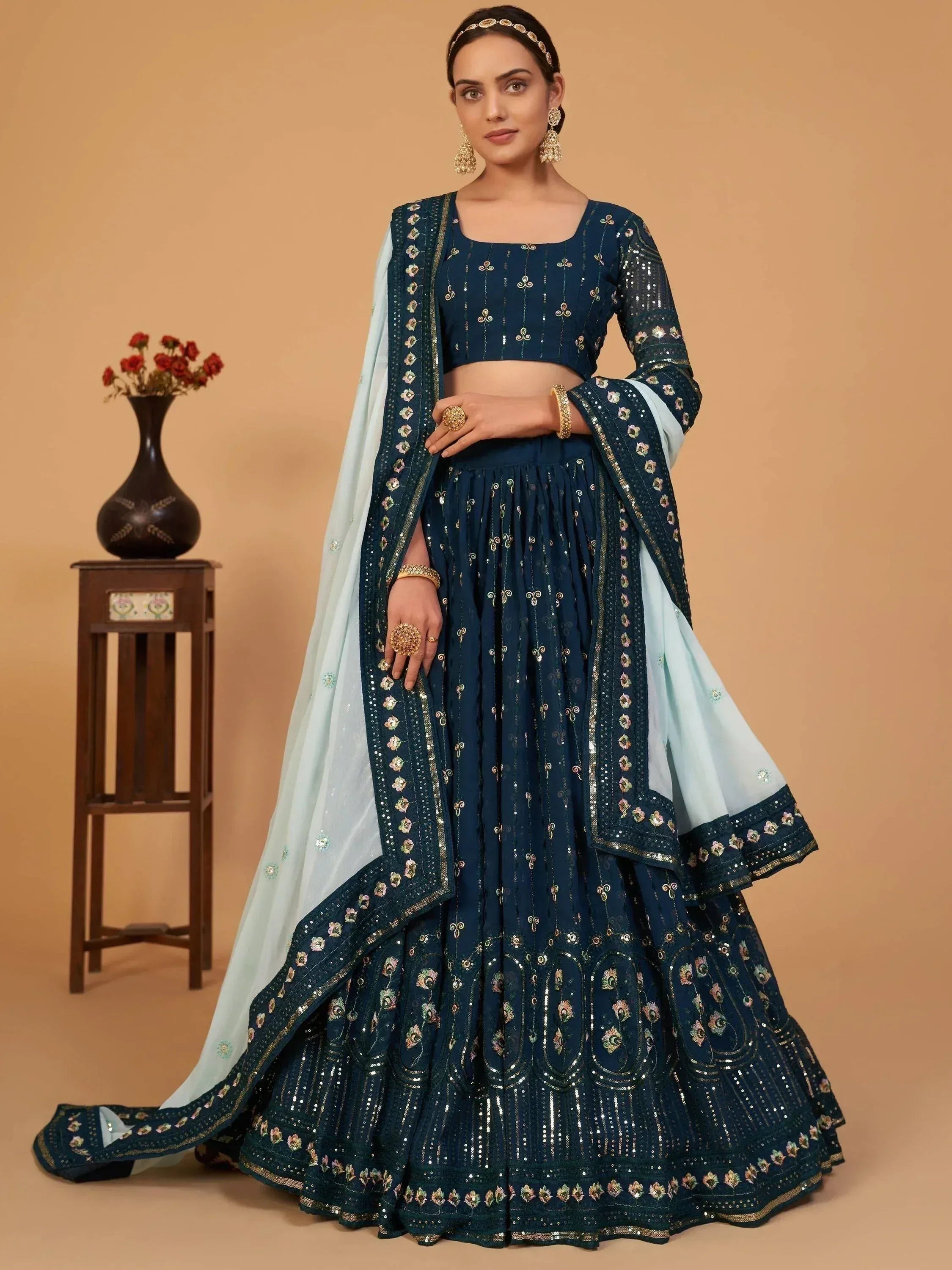 Navy blue embroidered lehenga choli with light blue dupatta, perfect for Indian ethnic wear occasions