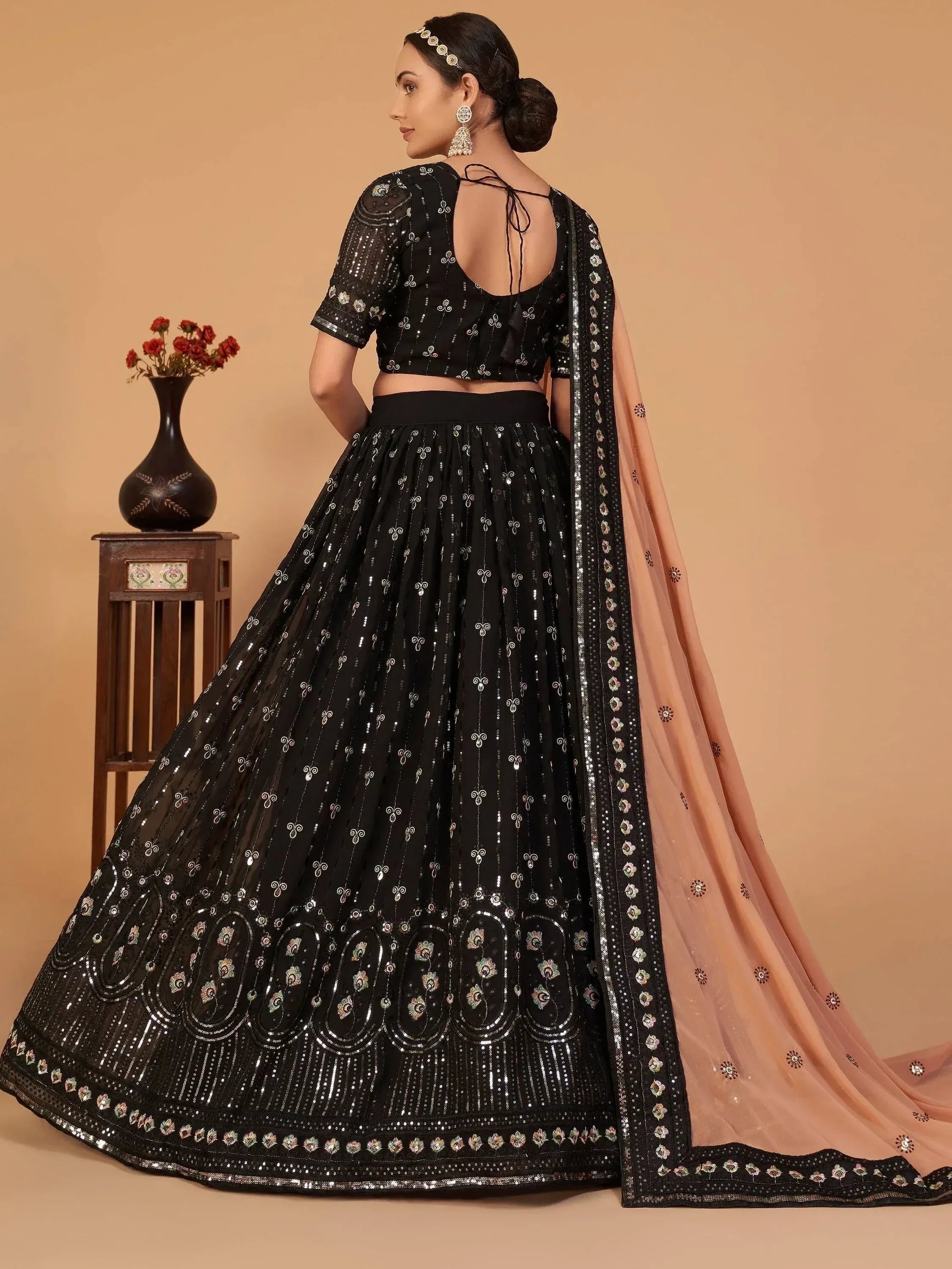 Black embroidered lehenga choli with peach dupatta, designer Indian ethnic wear for women