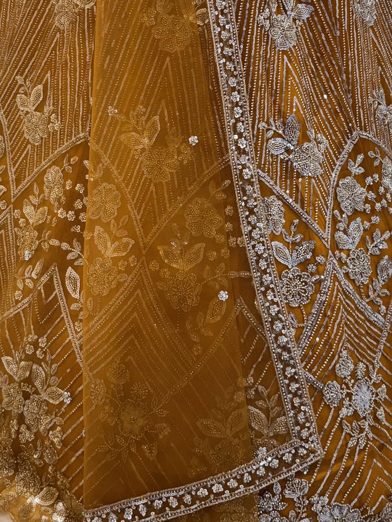 Glowing Mustard Yellow Bead Work Net Reception Wear Lehenga Choli