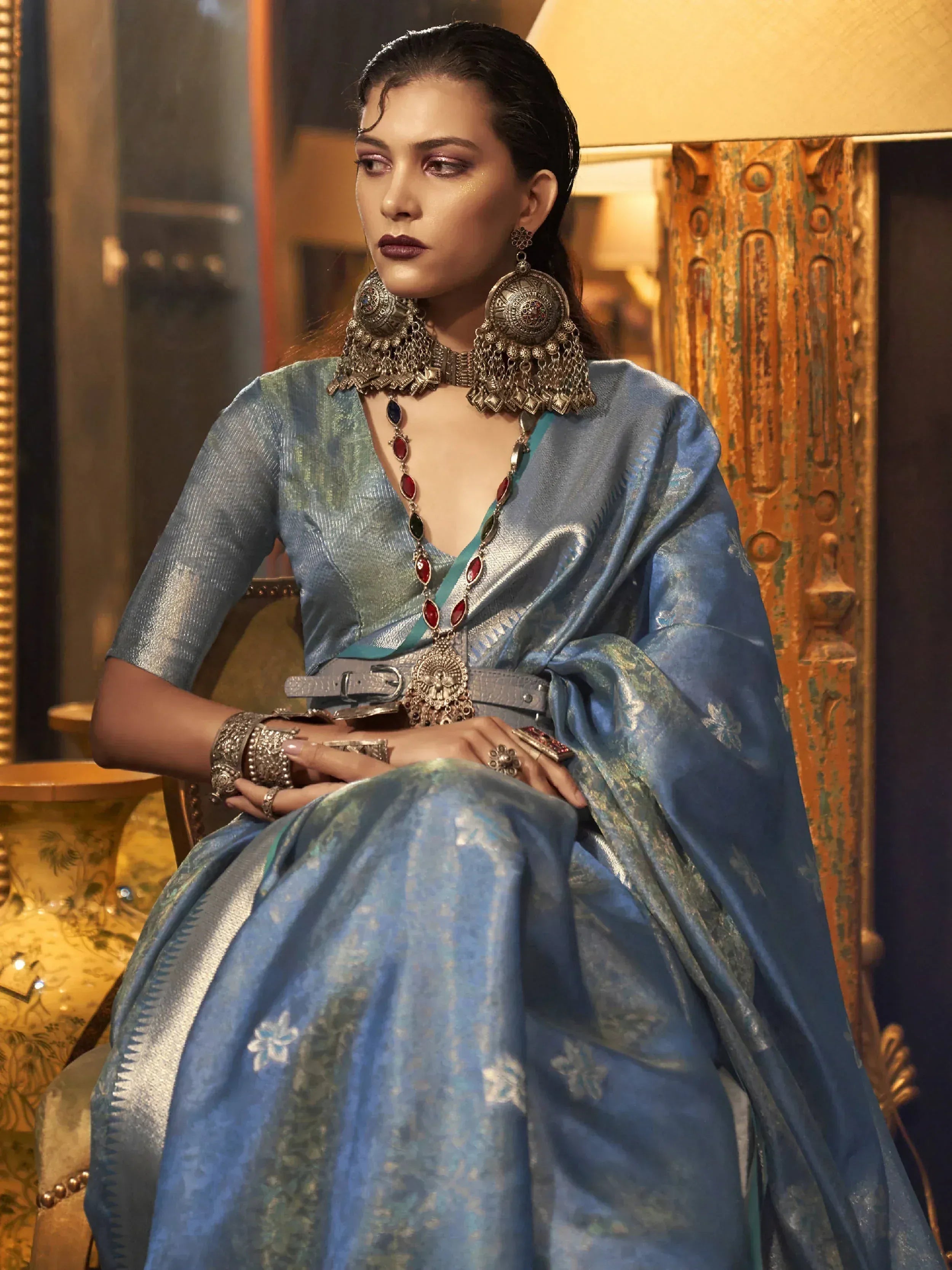 Blue designer lehenga choli with heavy ethnic jewelry, perfect for Indian weddings and festive occasions