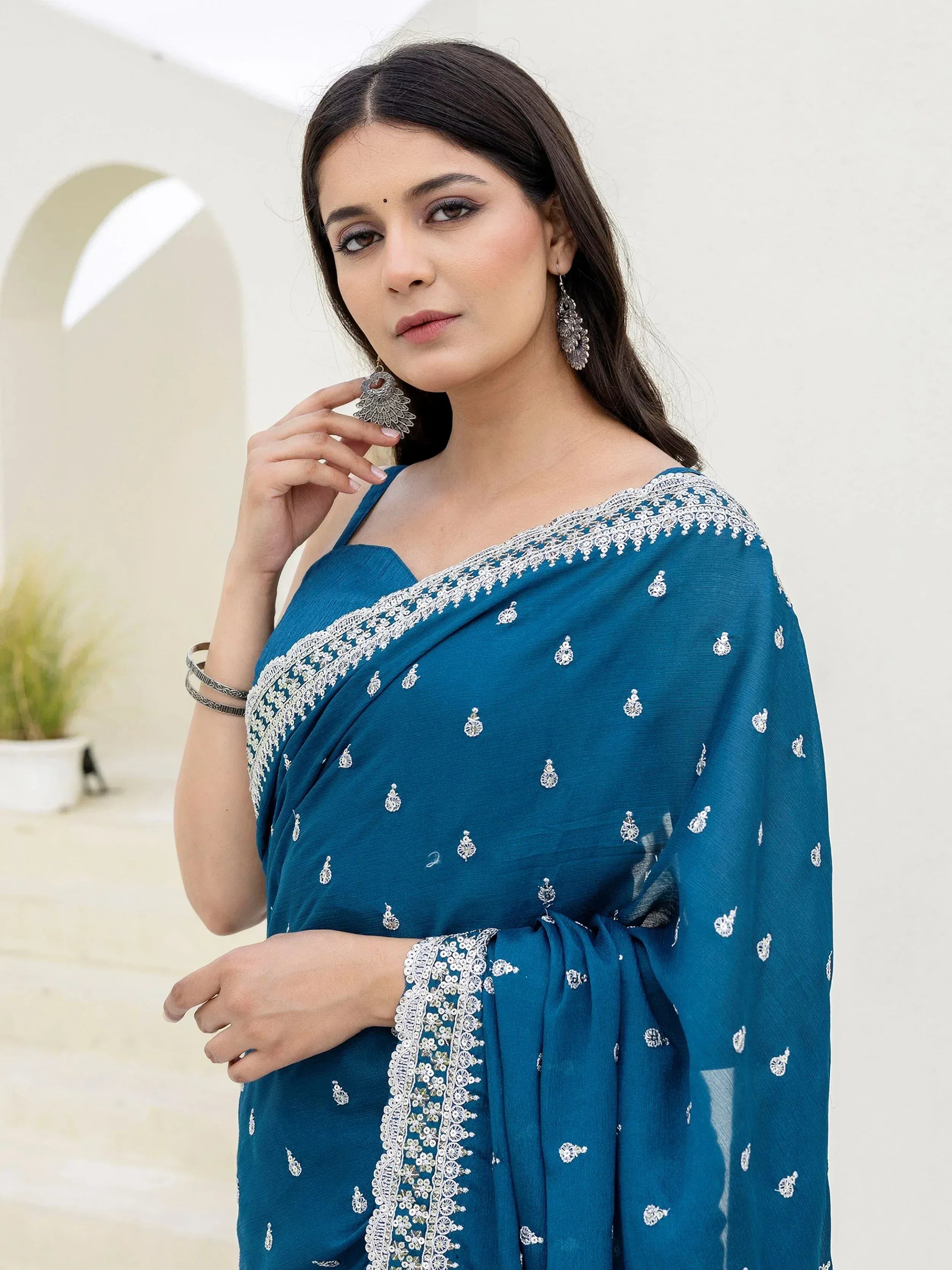 Elegant teal saree with white embroidery, perfect for Indian ethnic wear occasions.