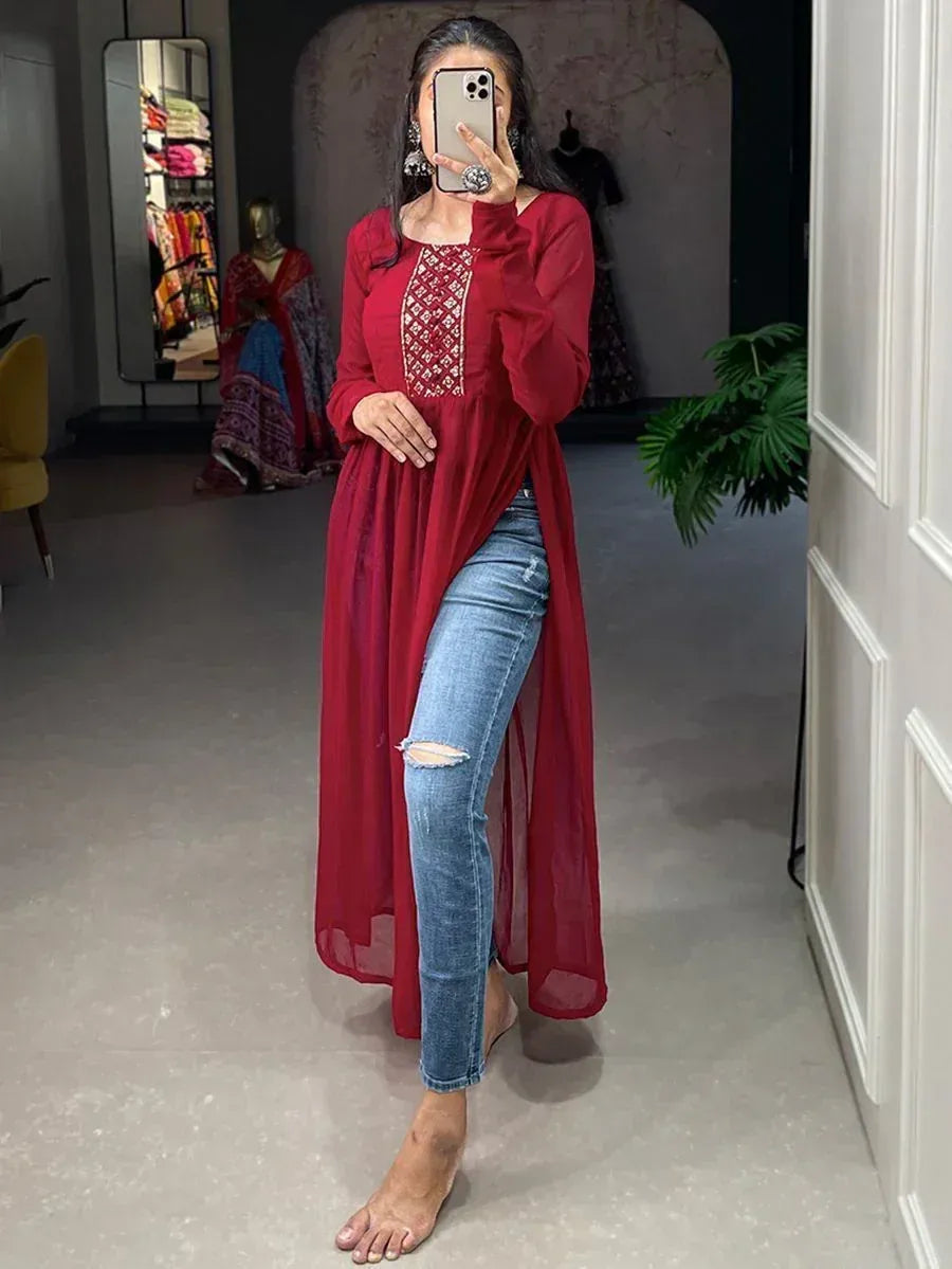 Red embroidered ethnic kurta with side slit paired with ripped jeans, stylish Indian wear