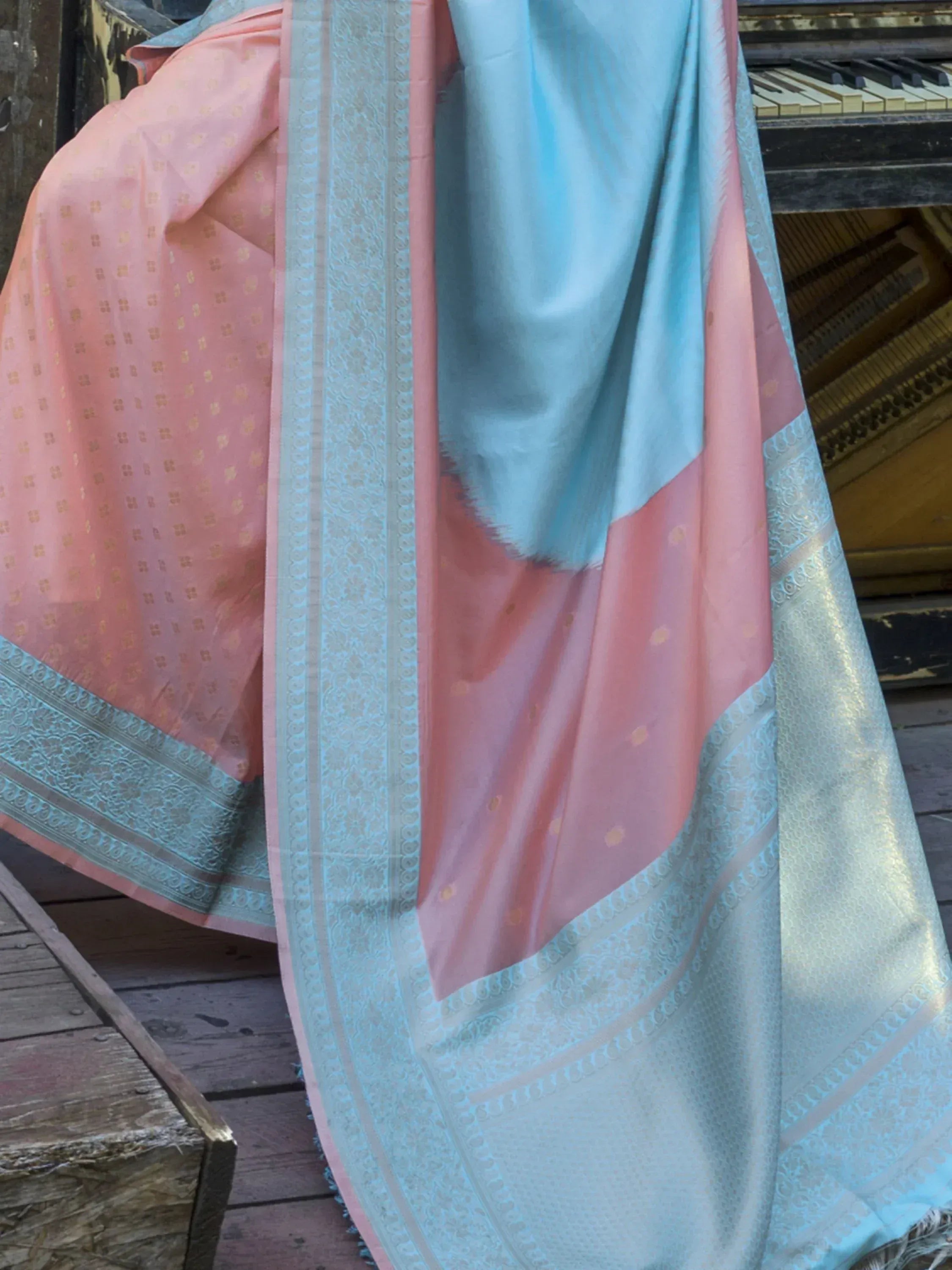 Pink and blue designer saree with gold motifs and intricate border, ideal for ethnic wear occasions