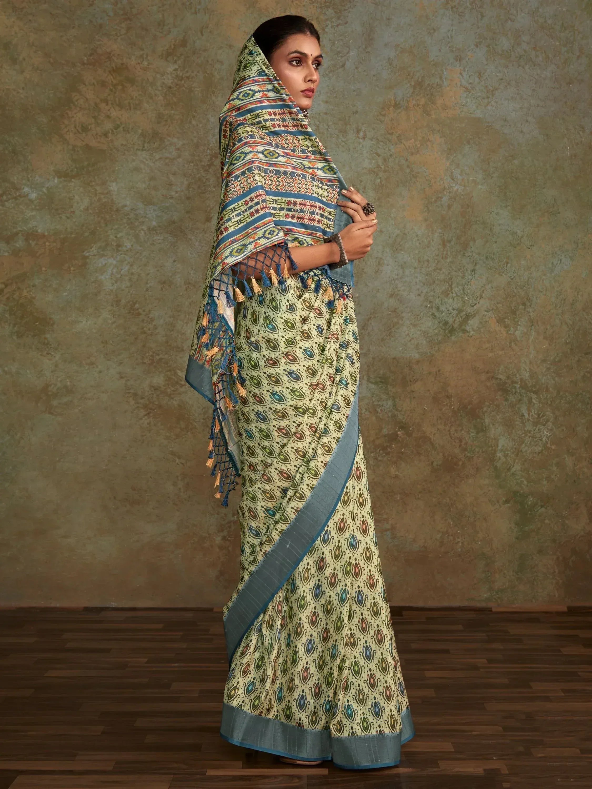Woman in printed ethnic saree with tassel border, ideal for Indian occasions and festive wear.