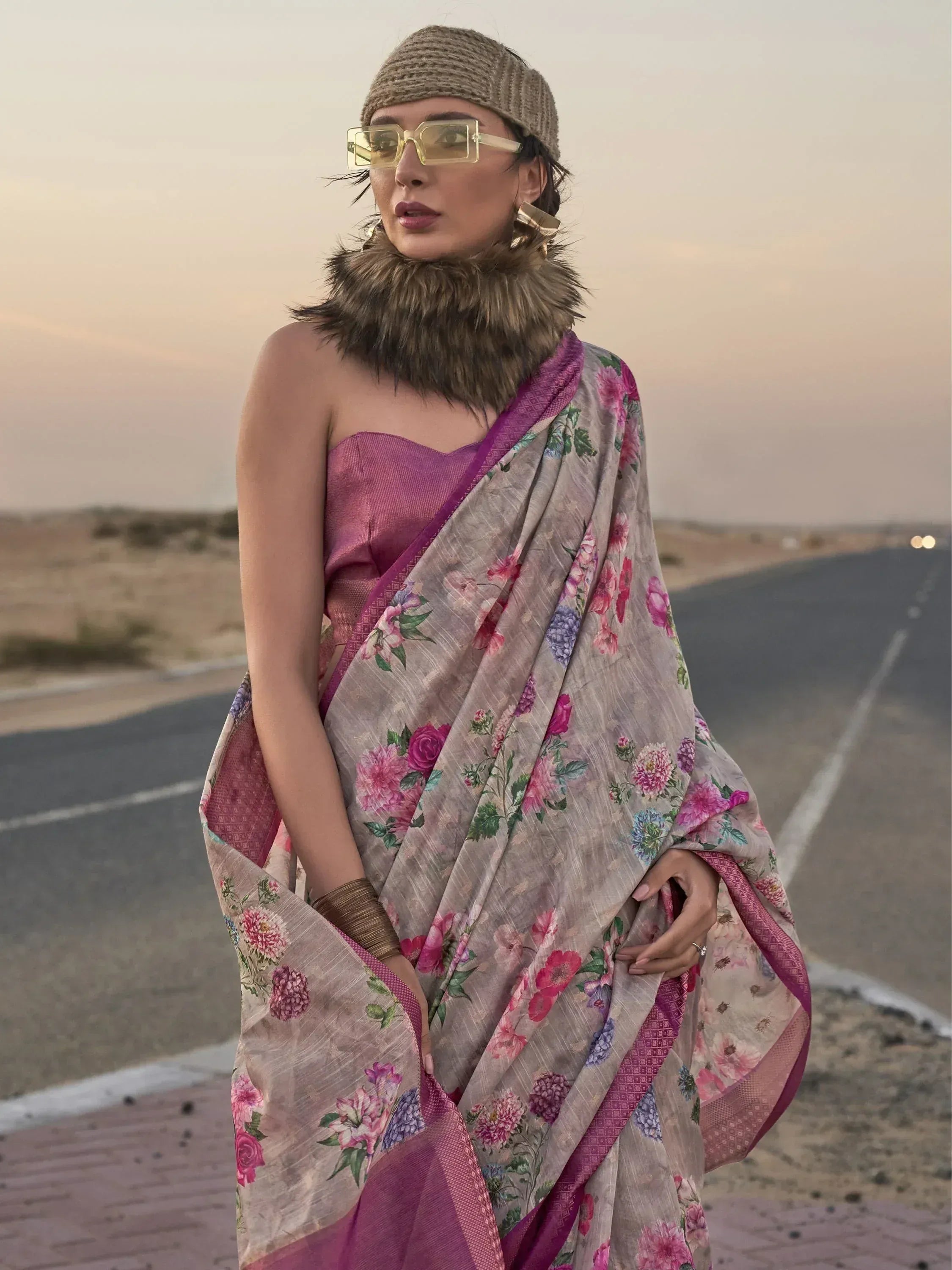 Floral print saree with purple blouse, styled with knit cap and fur collar for ethnic fashion