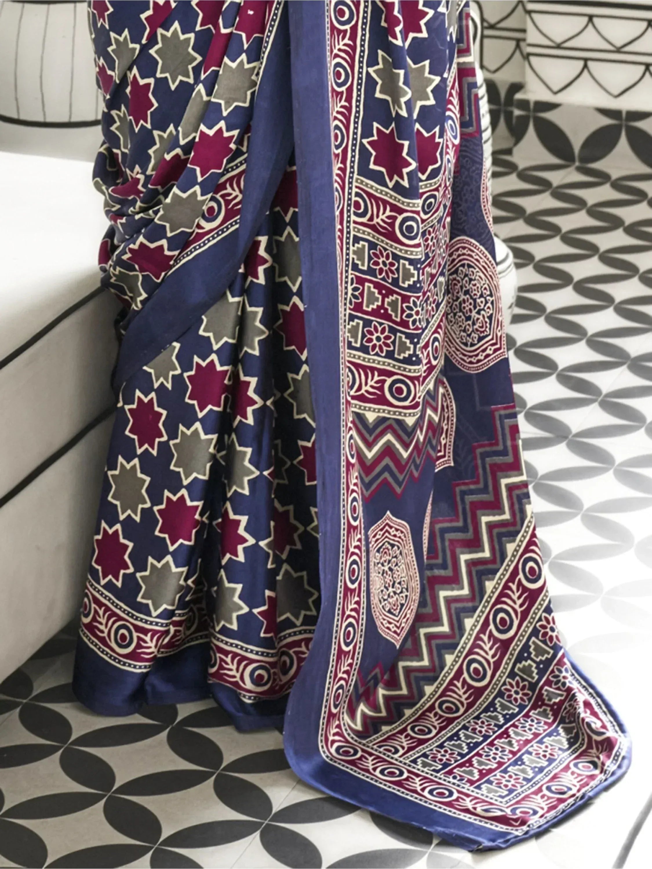 Blue and maroon printed saree with star and geometric patterns, ethnic Indian wear