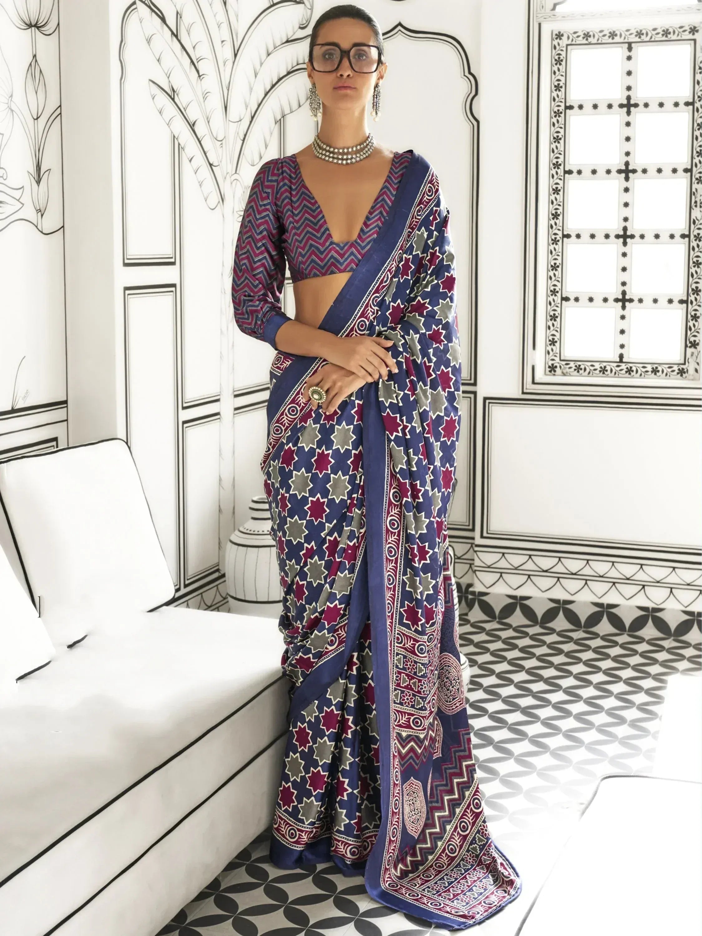 Woman in blue and maroon printed saree with chevron blouse, ethnic Indian wear