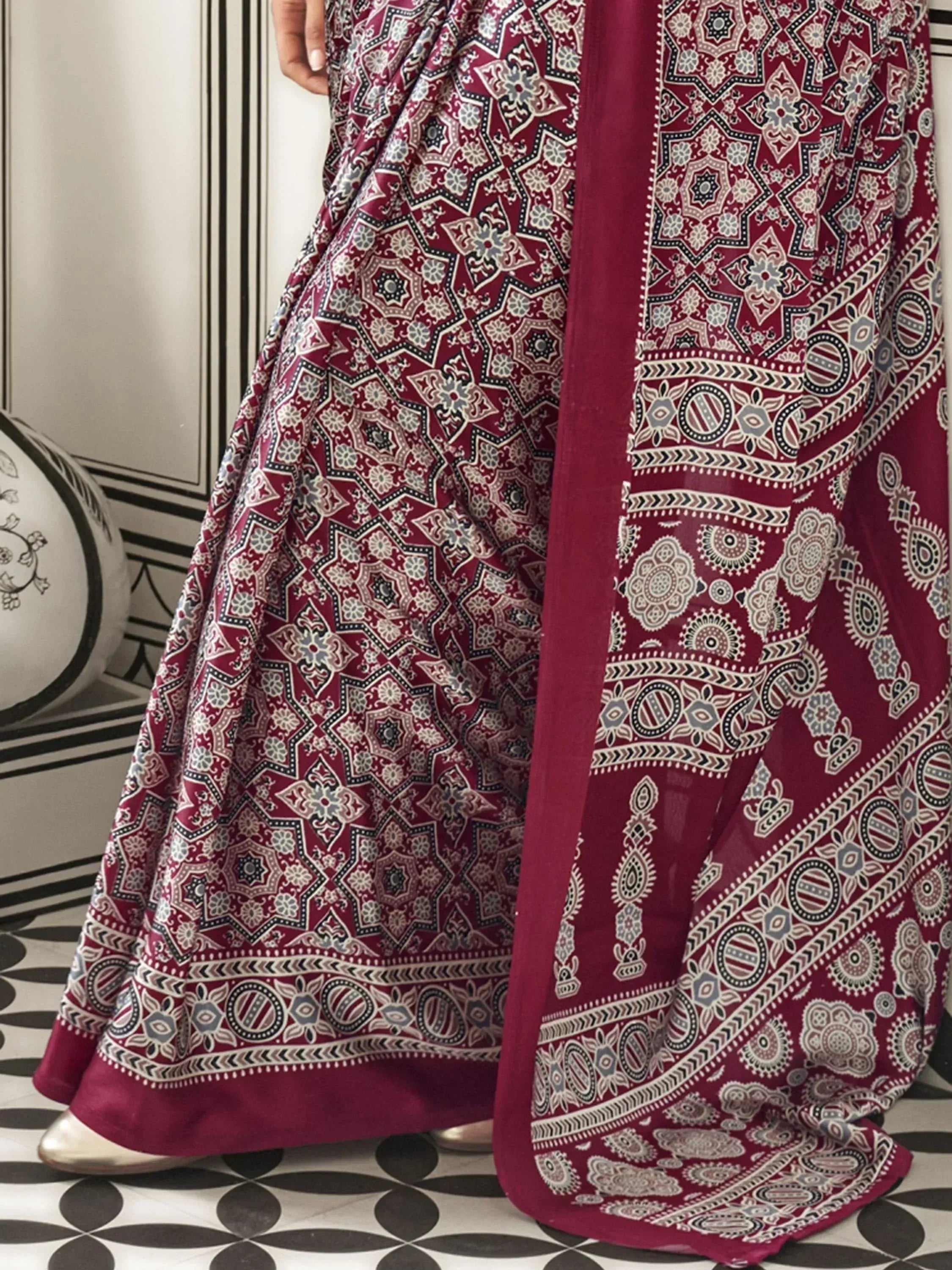 Maroon ethnic gown with intricate geometric and floral print, perfect for Indian occasions