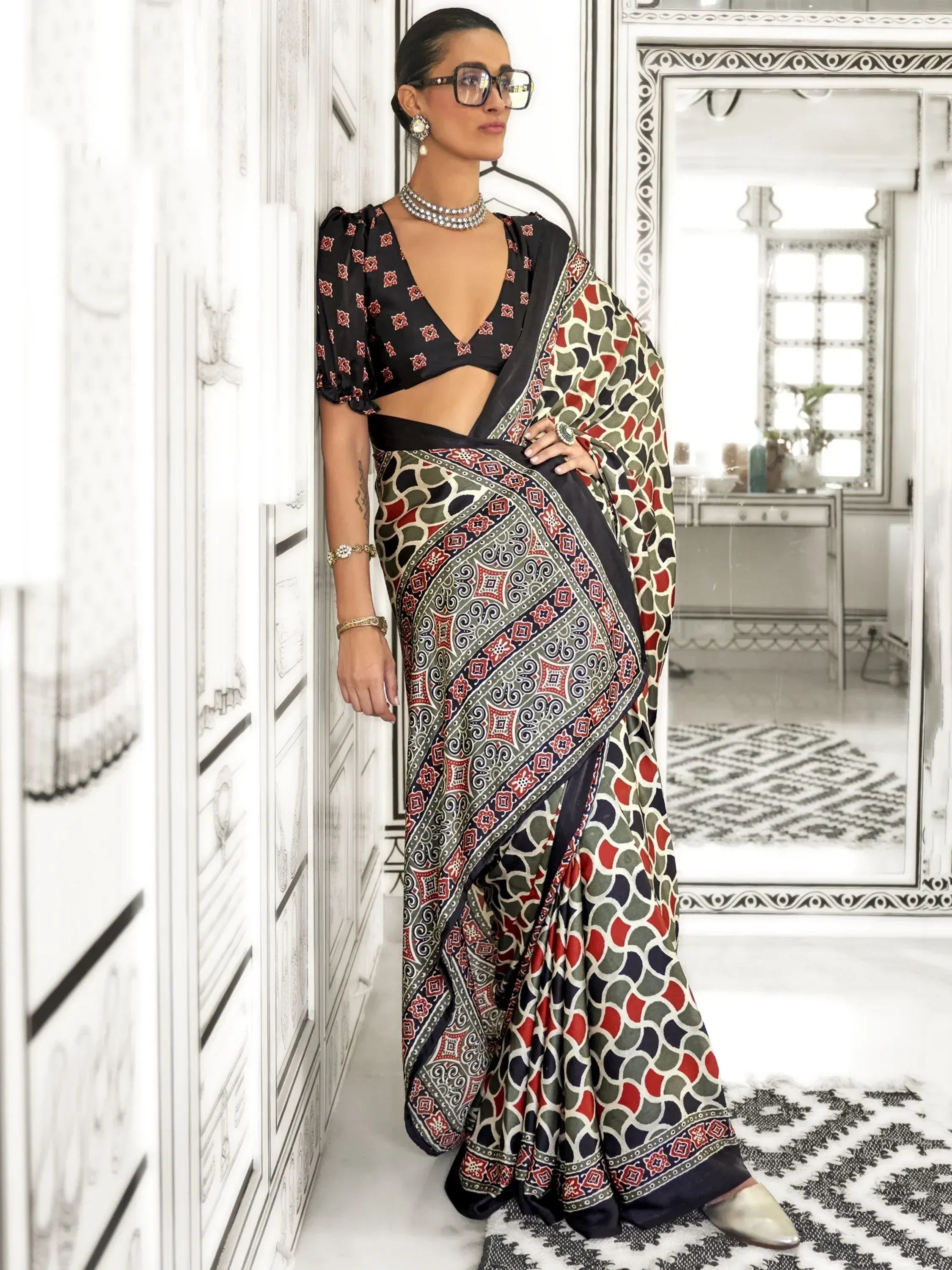 Woman in printed ethnic saree with puff sleeve blouse, stylish Indian wear for occasions
