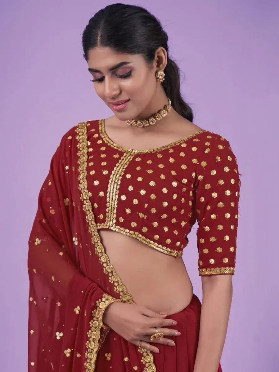 Maroon ethnic lehenga choli with gold floral embroidery and dupatta, perfect for Indian weddings and festivals