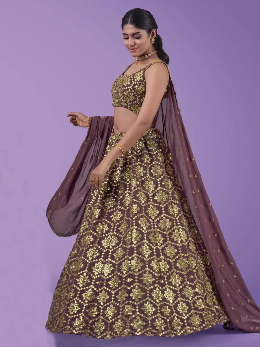 Elegant brown and gold embroidered lehenga choli with matching dupatta, perfect for Indian ethnic occasions.