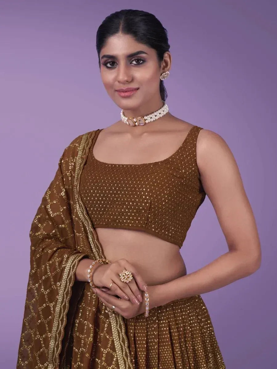 Brown sequin lehenga choli with gold embroidery, perfect for Indian ethnic wear and festive occasions