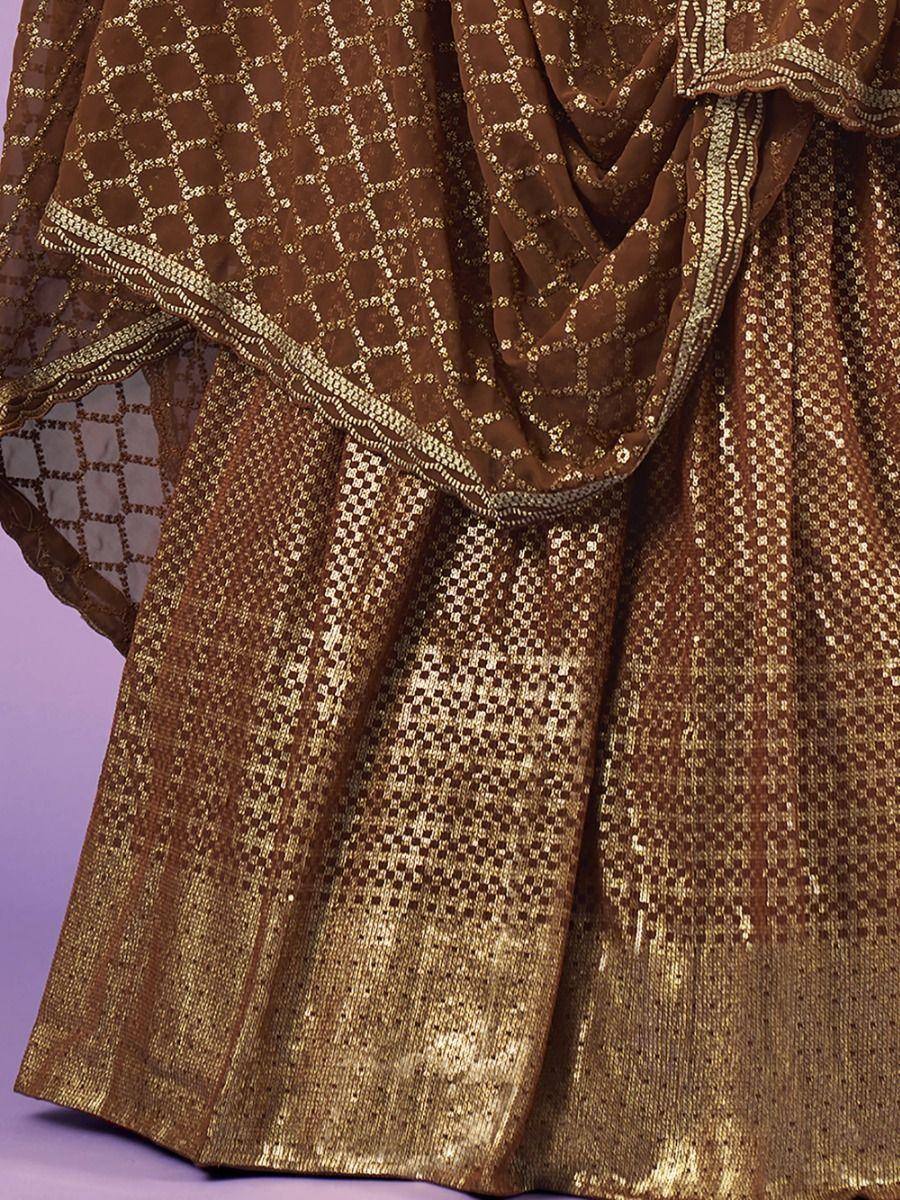 Brown and gold embroidered lehenga choli with intricate geometric patterns and sequin detailing