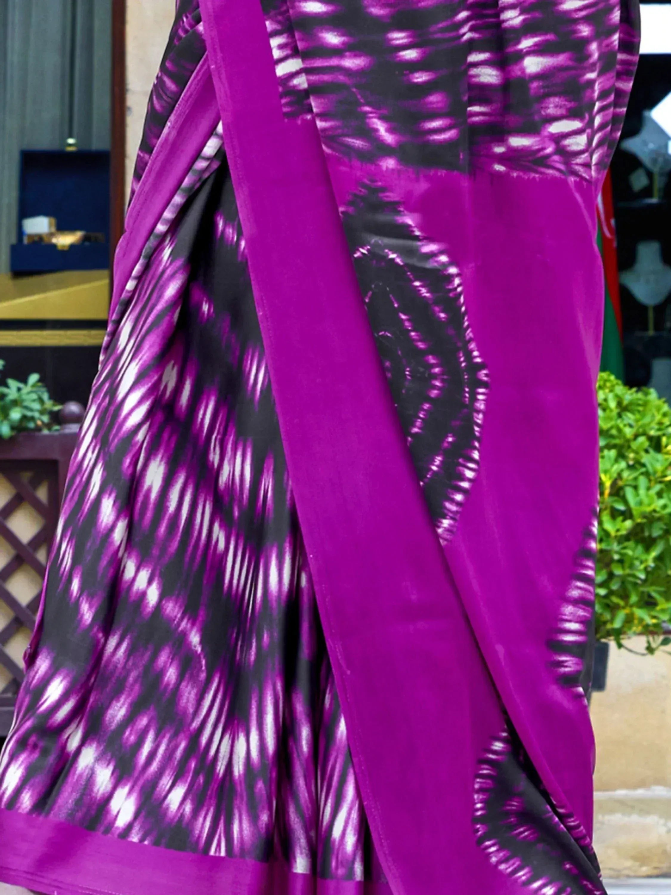 Vibrant purple and black ikat print saree with solid border, ethnic Indian wear