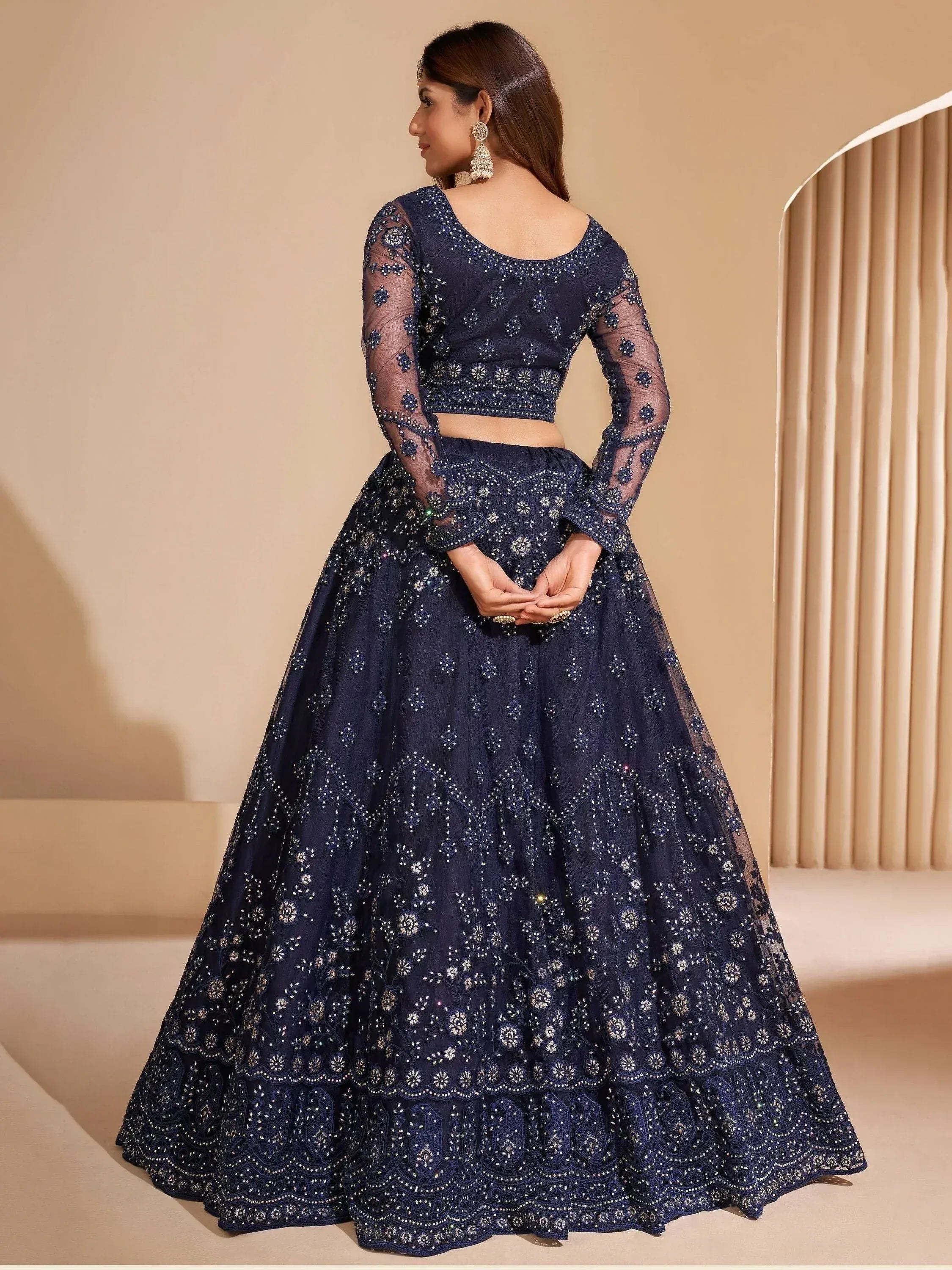 Navy blue embroidered lehenga choli with sheer sleeves, perfect for Indian ethnic occasions