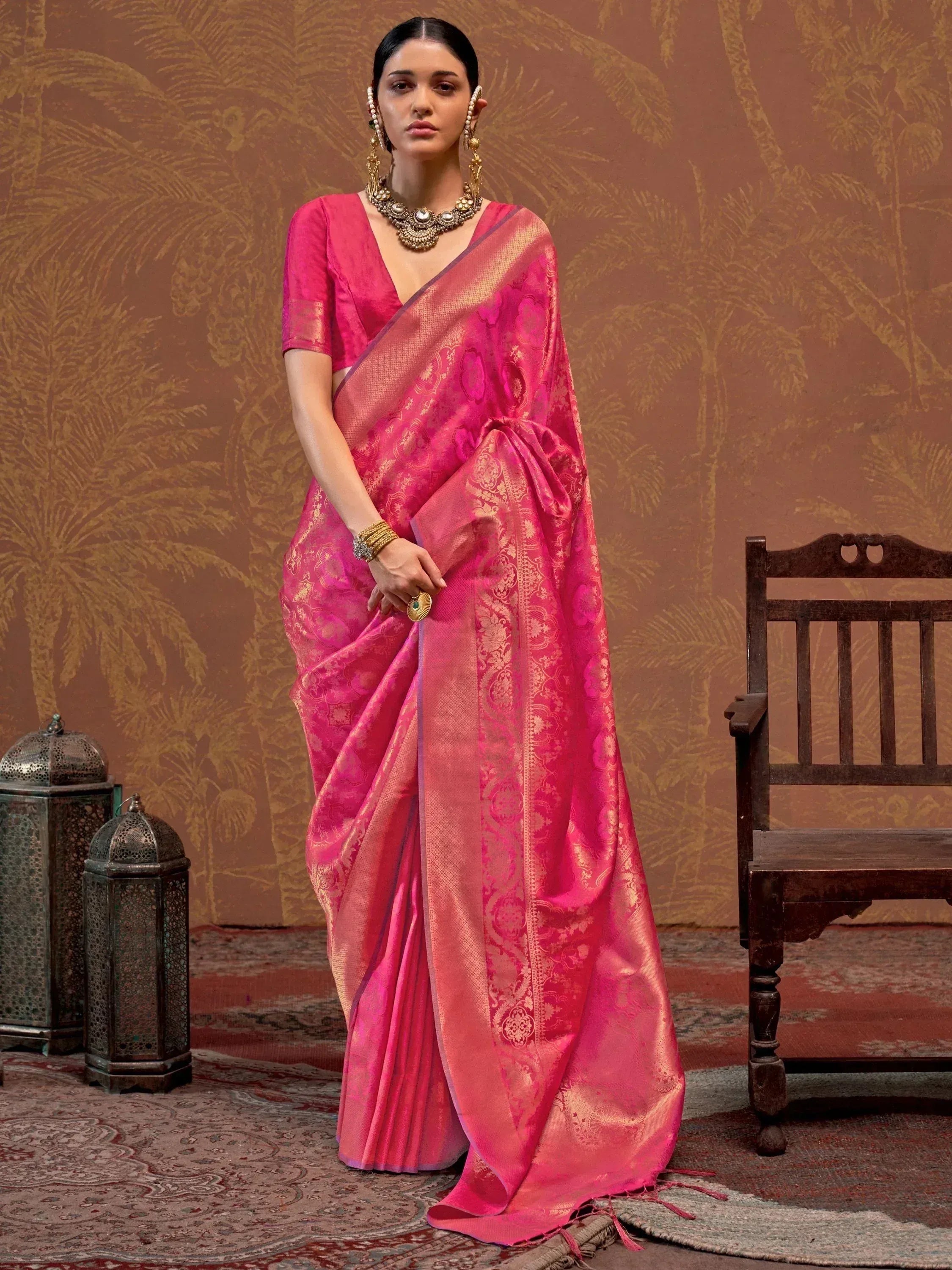 Vibrant pink designer saree with gold brocade, perfect for Indian ethnic wear and festive occasions.